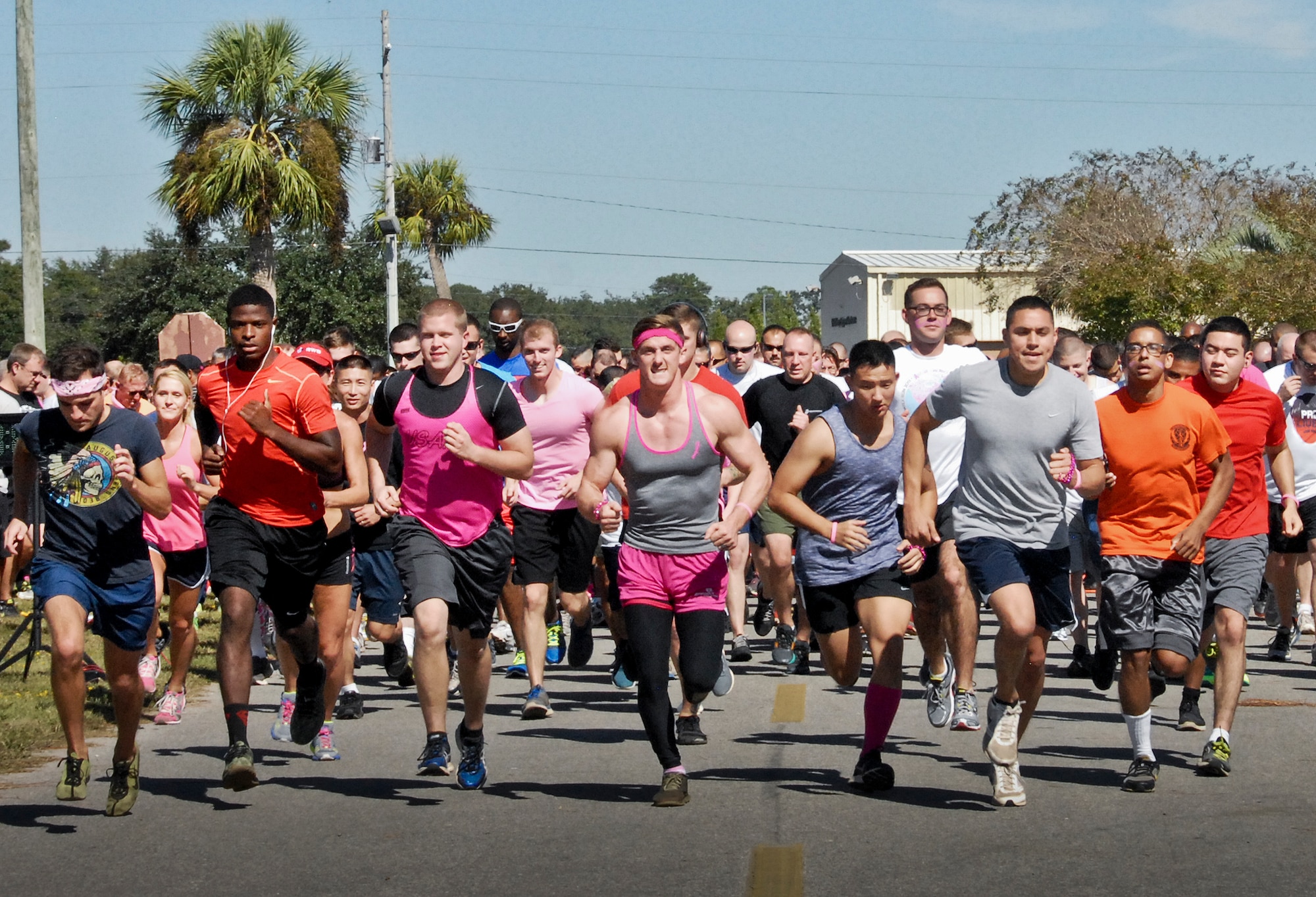 Runners dress in pink to support the 7th Annual Breast Cancer Awareness 5k run Oct. 17 at Eglin Air Force Base, Fla.  Civilian Health Promotion Services was also on hand providing information on breast cancer risk factors, symptoms and screenings.  The event was held to promote breast cancer awareness and the importance of self-examination to catch the disease in its early stages.  (U.S. Air Force photo/Kevin Gaddie)