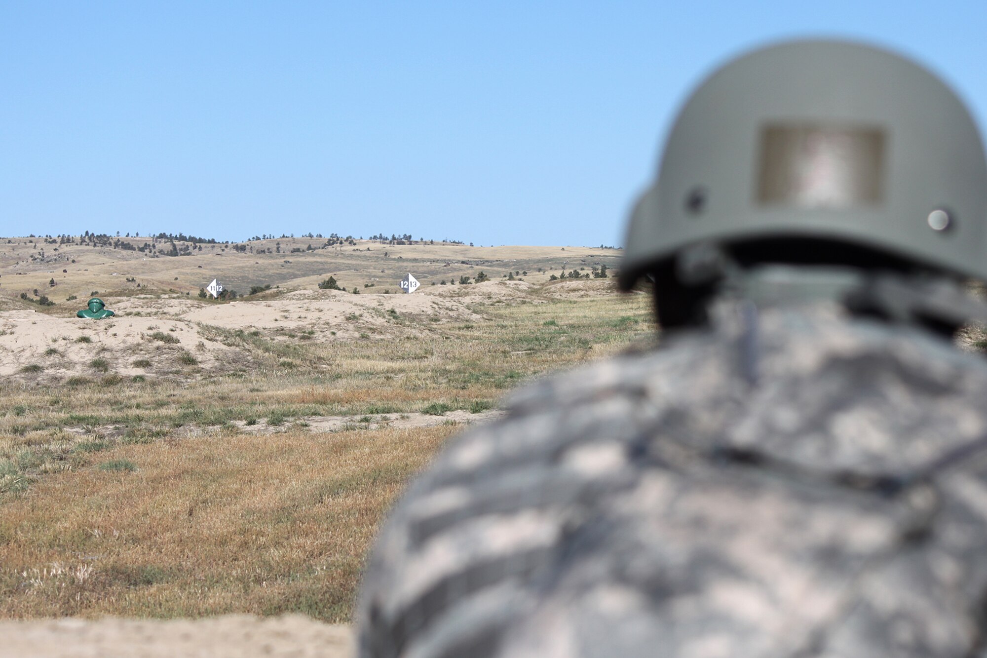 A member of the 307th Security Forces Squadron waits for a target to pop-up during the Global Strike Challenge Weapons Firing Competition, Sept. 24, 2014, Camp Guernsey, Wyo. The Global Strike Challenge is the world's premier bomber, Intercontinental Ballistic Missile, helicopter operations and security forces competition with units from Air Force Global Strike Command, Air Combat Command, Air Force Reserve Command and the Air National Guard. (U.S. Air Force photo by Tech. Sgt. Starlight Lesher/Released)
