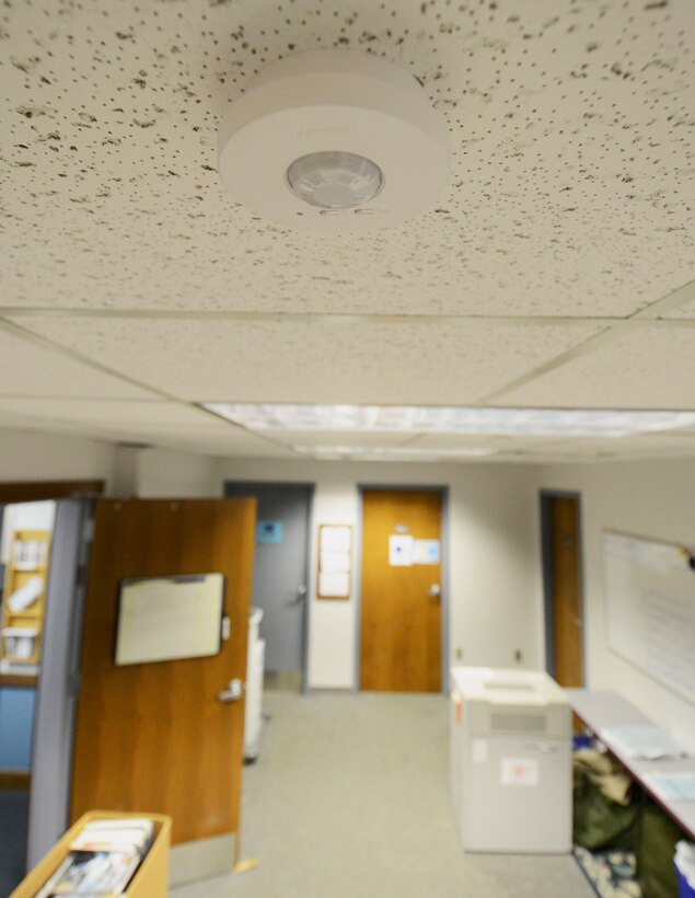 A ceiling sensor controls lighting in 914th Airlift Wing Headquarters, at the Niagara Falls Air Reserve Station. Sensors like this are all around the installation, turning on for people entering an area, and switching off when no movement is sensed, saving the U.S. Air Force money on electricity. October is Energy Action Month throughout the federal government and is about creating an Energy Aware Culture, where Airmen are getting personally involved and finding innovative ways to help the Air Force meet our energy goals. (U.S. Air Force photo by Tech. Sgt. Andrew Caya)
