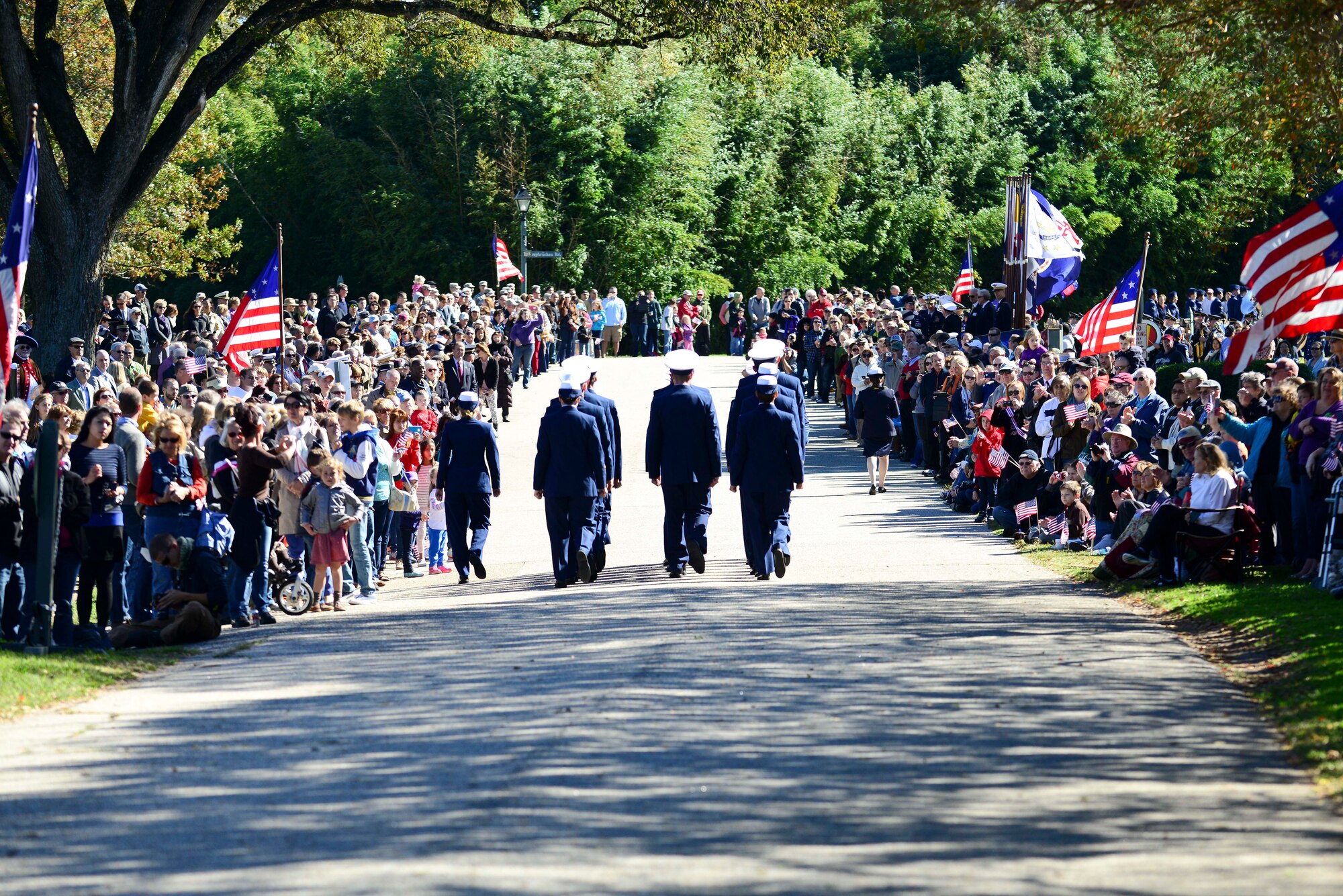 Members of the U.S. Coast Guard make their way toward a crowd while marching the annual Yorktown Day parade in Yorktown, Va., Oct. 19, 2014. The day celebrated the 233rd anniversary of the victory at Yorktown. (U.S. Air Force photo by Airman 1st Class Kimberly Nagle/ Released)