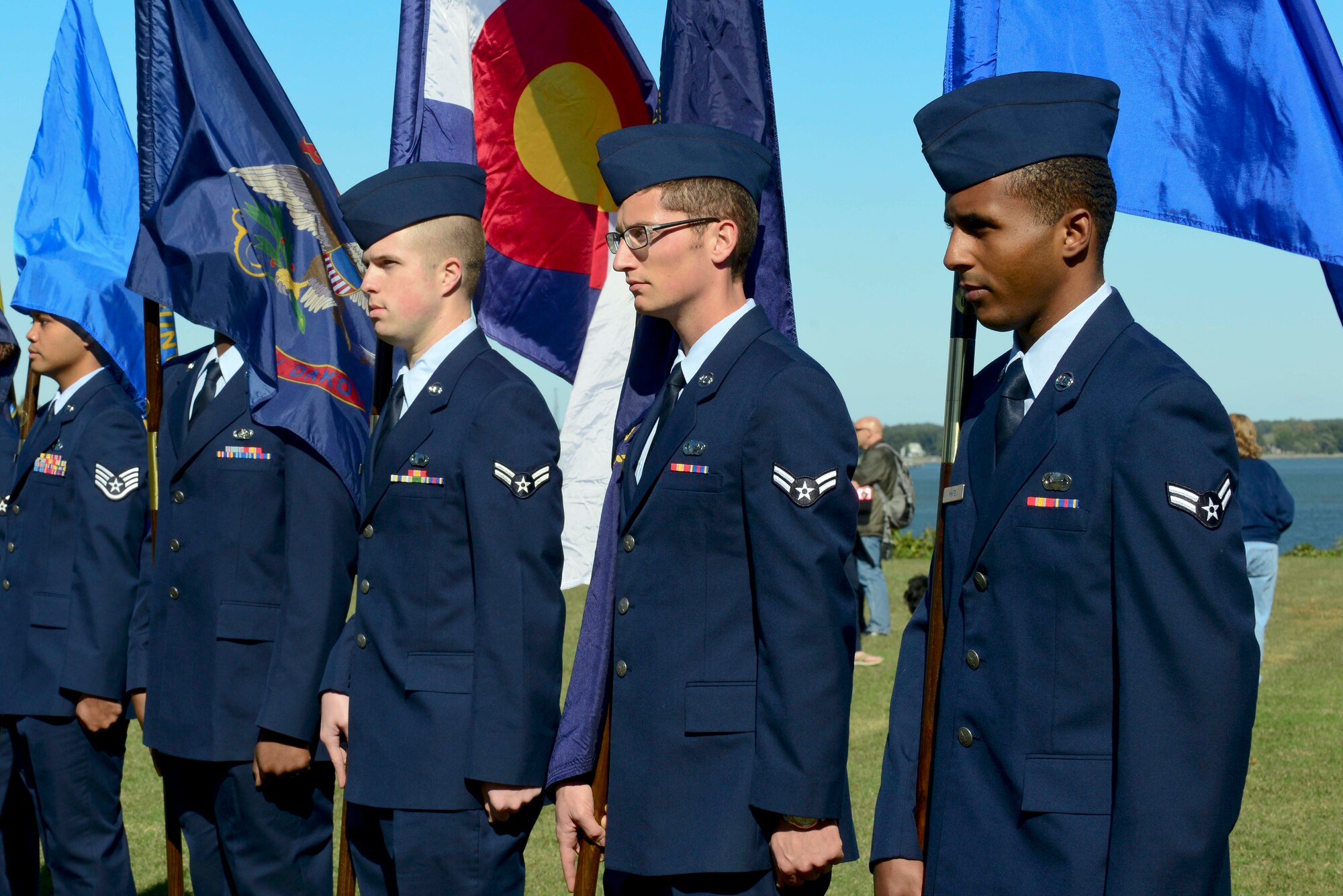U.S. Air Force Airmen from Joint Base Langley-Eustis, Va., stand with their flags during the Parade of Flags at the annual Yorktown Day celebration, in Yorktown, Va., Oct. 19, 2014. Service members from each branch were part of the flag presentation. (U.S. Air Force photo by Airman 1st Class Kimberly Nagle/ Released)