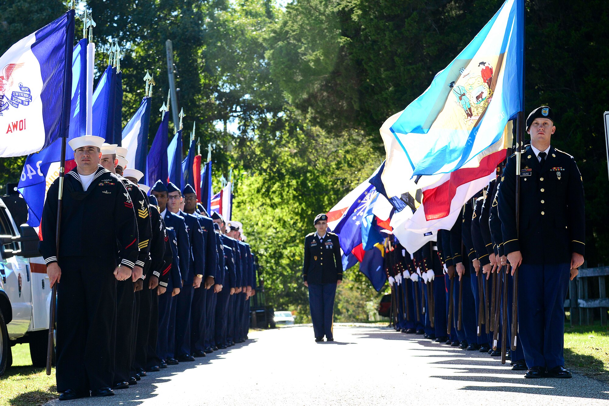 Service members prepare to present the Parade of Flags during the annual Yorktown Day celebration, in Yorktown, Va., Oct. 19, 2014. Service members presented the flags from every state. (U.S. Air Force photo by Airman 1st Class Kimberly Nagle/ Released)
