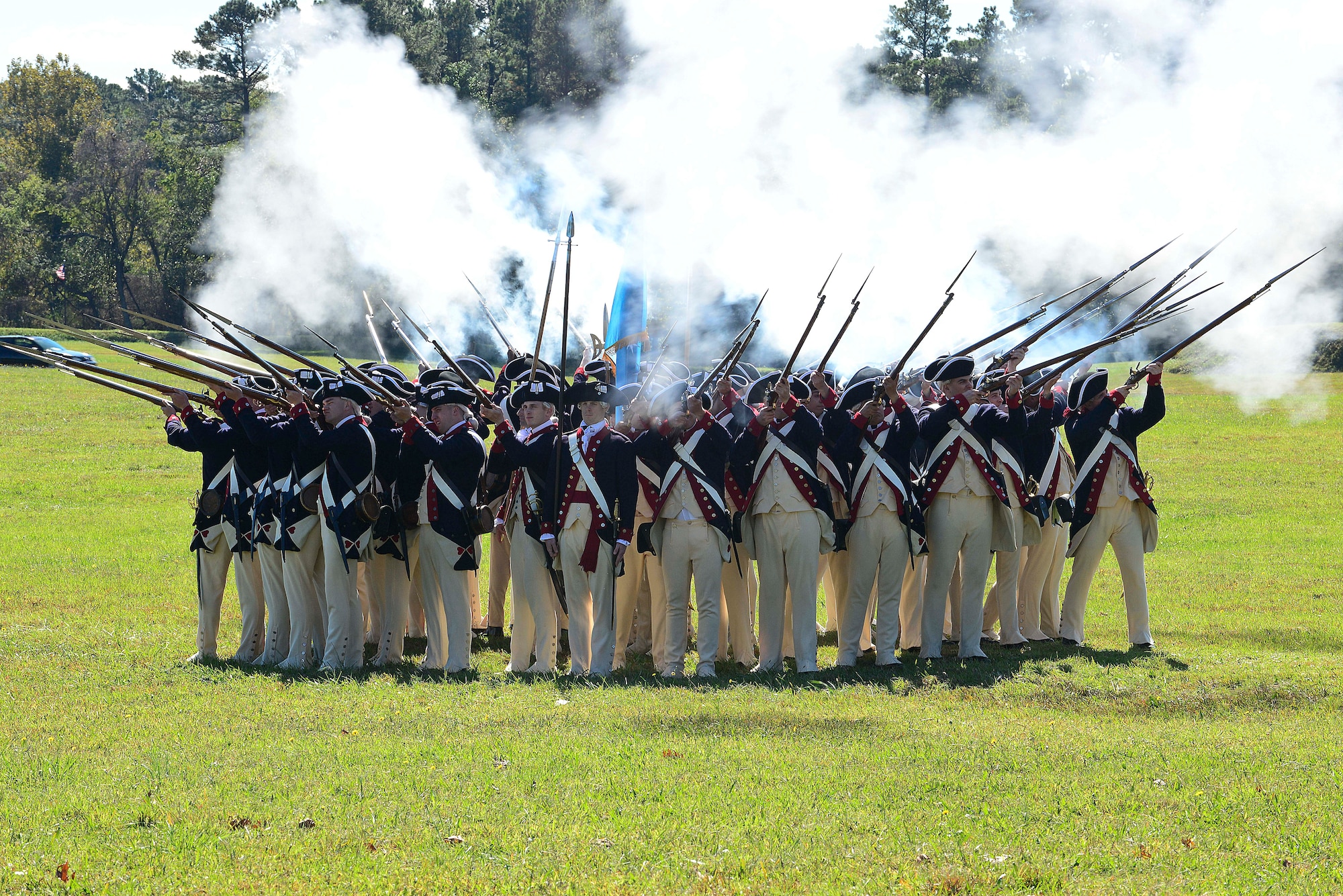 Members of the 3rd Infantry Regiment – Commander-in-Chief’s Guard, from Joint Base Myer-Henderson Hall at Fort Myer, Va., stand in a defensive formation during the Revolutionary War as part of the annual Yorktown Day celebration, in Yorktown, Va., Oct. 19, 2014. The regiment’s fife and drum corps also preformed during the events.  (U.S. Air Force photo by Airman 1st Class Kimberly Nagle/ Released)
