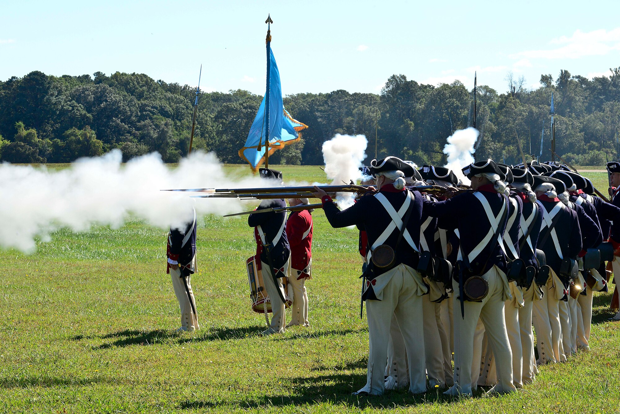 Members of the 3rd Infantry Regiment – Commander-in-Chief’s Guard, from Joint Base Myer-Henderson Hall at Fort Myer, Va., demonstrate battle techniques used during the Revolutionary War in Yorktown, Va., as part of the annual Yorktown Day celebration, Oct. 19, 2014. The celebration included a parade and other festivities including wreath laying ceremonies. (U.S. Air Force photo by Airman 1st Class Kimberly Nagle/ Released)
