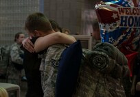 Deployers from the North Dakota Air National Guard’s 219th Security Forces Squadron are welcomed home at the Minot International Airport Oct. 15. 2014. The Airmen provided support to the U.S. Central Command during a six-month deployment to Southwest Asia. (U.S. Air Force photo/Airman 1st Class Lauren Pitts)