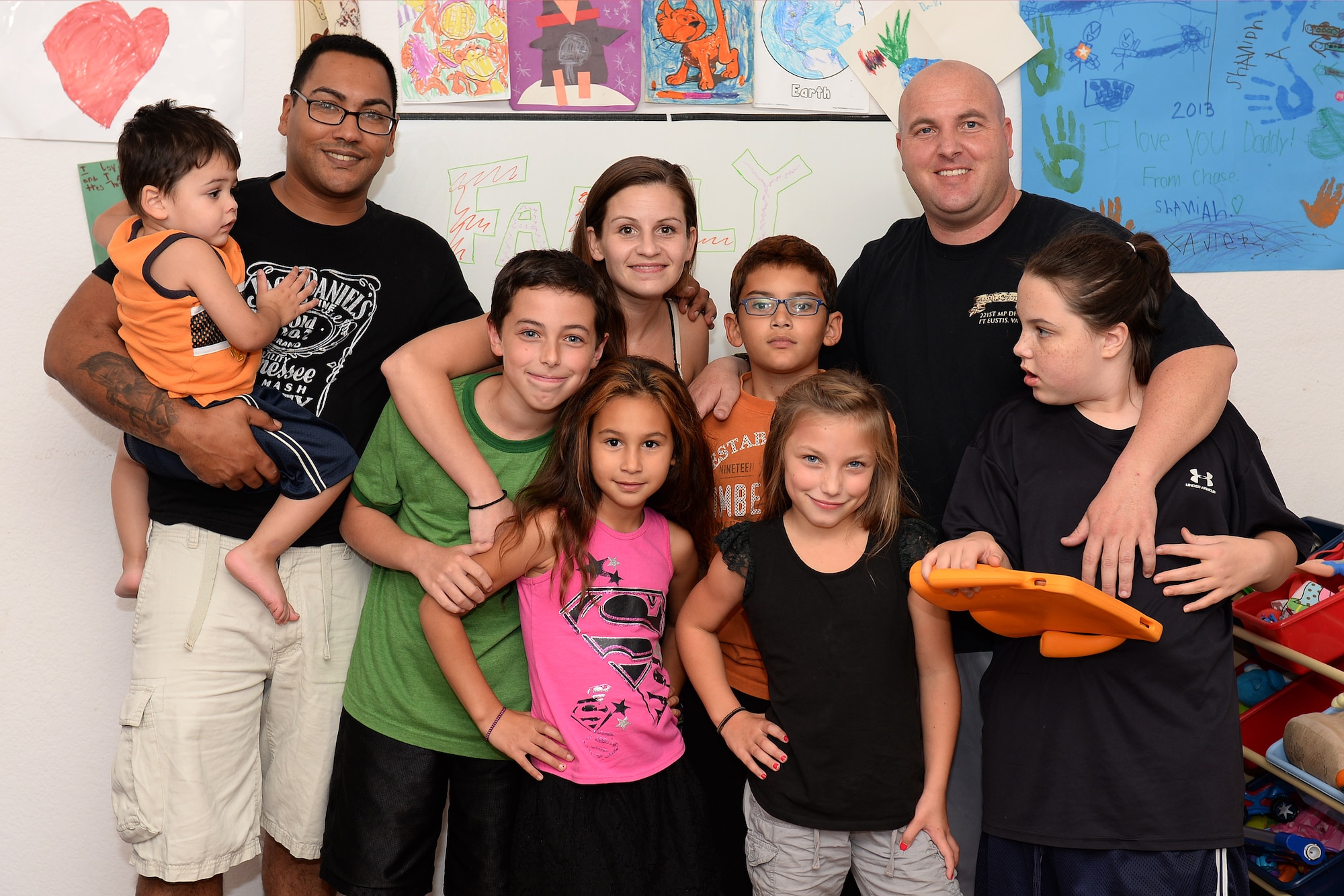 The Arrington family and the Philman family blend into one when U.S. Army Spc. Robert Philman’s children spend time with him in the Arrington’s home at Fort Eustis, Va., Oct. 15, 2014. The Arringtons helped take care of the Philman family after Philman was recovering from surgery. (U.S. Air Force photo by Staff Sgt. Teresa J. Cleveland/Released)