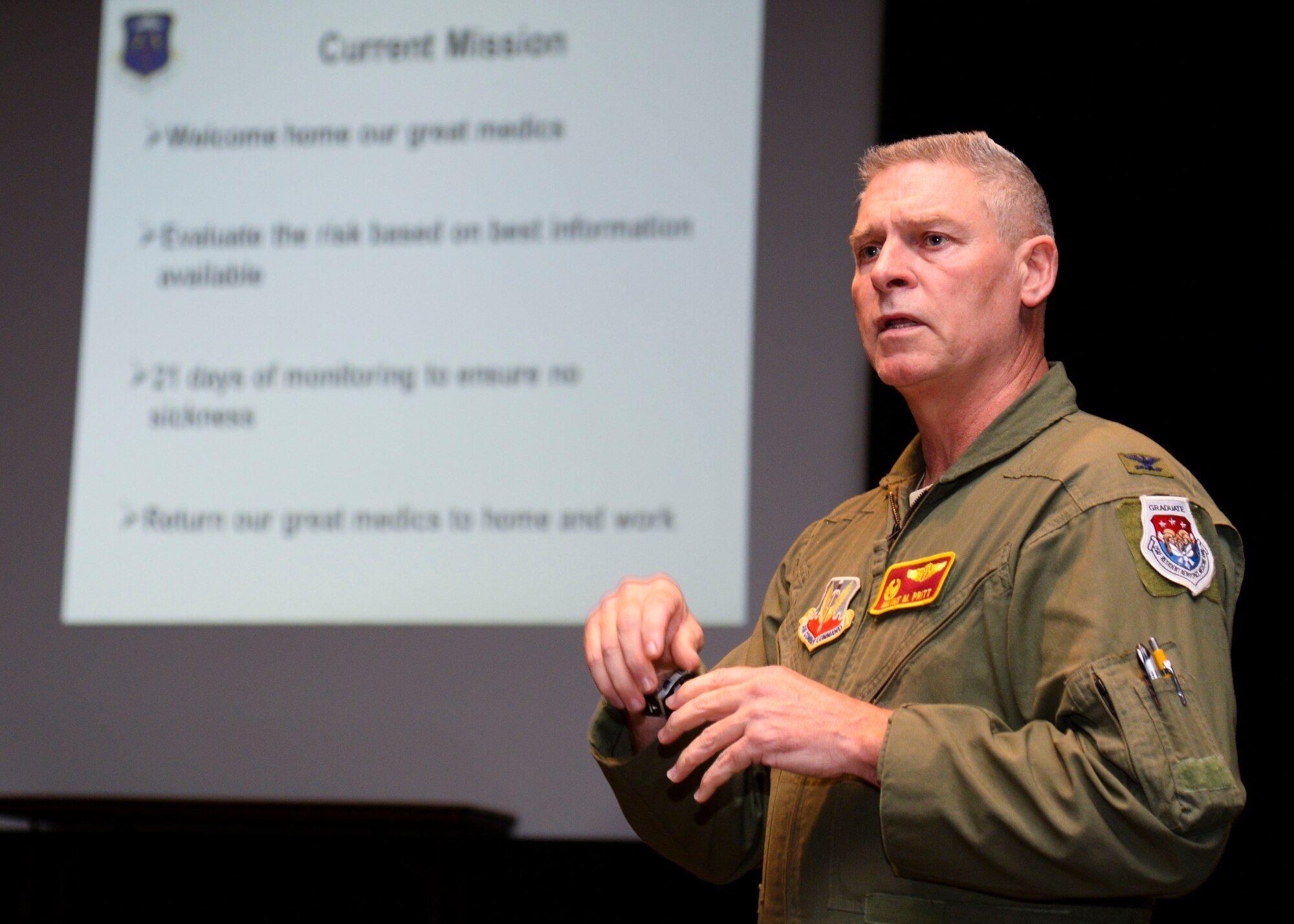 U.S. Air Force Col. Wayne Pritt, 633rd Medical Group commander, explains the safety status of the returning 633rd MDG Airmen during a reintergration briefing at Langley Air Force Base, Va., Oct. 20, 2014. Pritt told family members the returning Airmen had no known exposure to Ebola patients, and he encouraged family members to treat their returning Airmen no differently. (U.S. Air Force photo by Senior Airman Austin Harvill/Released)