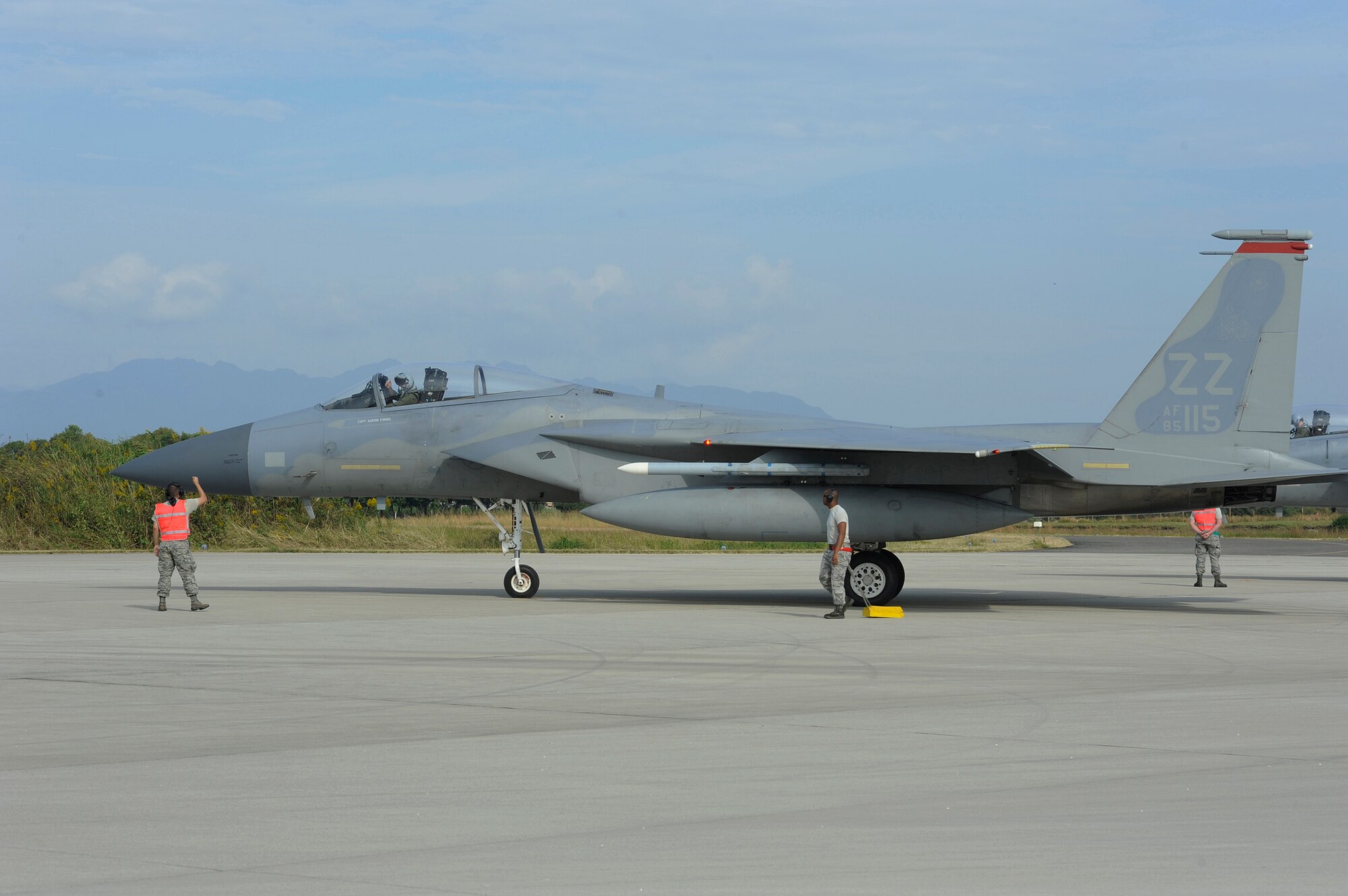 Members of the 18th Aircraft Maintenance Squadron complete a final inspection of an F-15 Eagle from Kadena Air Base, Japan, before allowing it to take-off on Nyutabaru Air Base, Japan, Oct. 20, 2014. The 5th Air Wing, 8th Air Wing and the 67th Fighter Squadron are participating in a two week-long bilateral Aviation Training Relocation Program to build operational readiness and interoperability. (U.S. Air Force photo by Senior Airman Marcus Morris/Released)