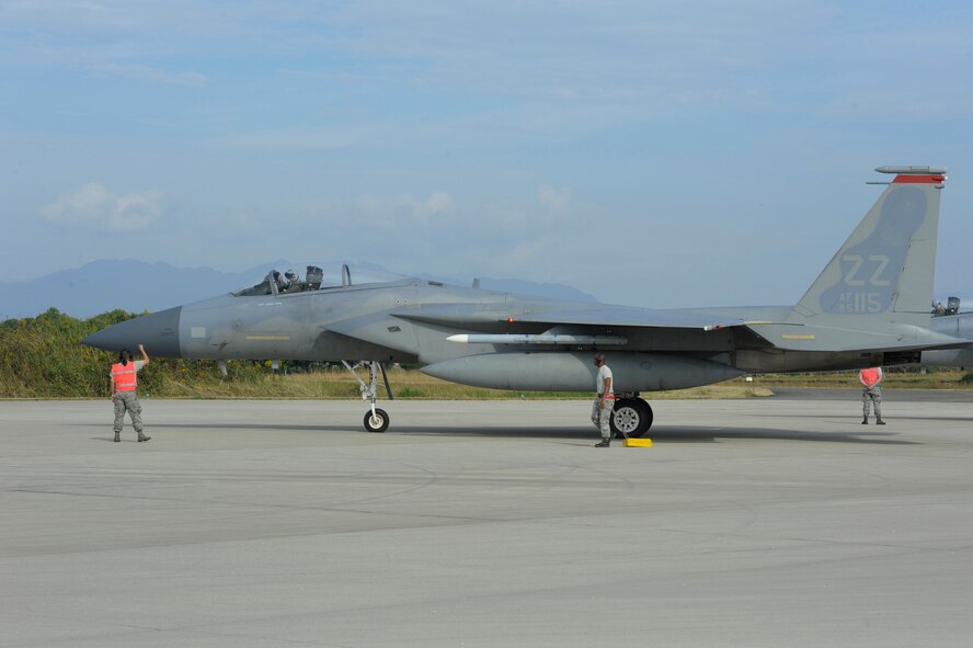 Members of the 18th Aircraft Maintenance Squadron complete a final inspection of an F-15 Eagle from Kadena Air Base, Japan, before allowing it to take-off on Nyutabaru Air Base, Japan, Oct. 20, 2014. The 5th Air Wing, 8th Air Wing and the 67th Fighter Squadron are participating in a two week-long bilateral Aviation Training Relocation Program to build operational readiness and interoperability. (U.S. Air Force photo by Senior Airman Marcus Morris/Released)