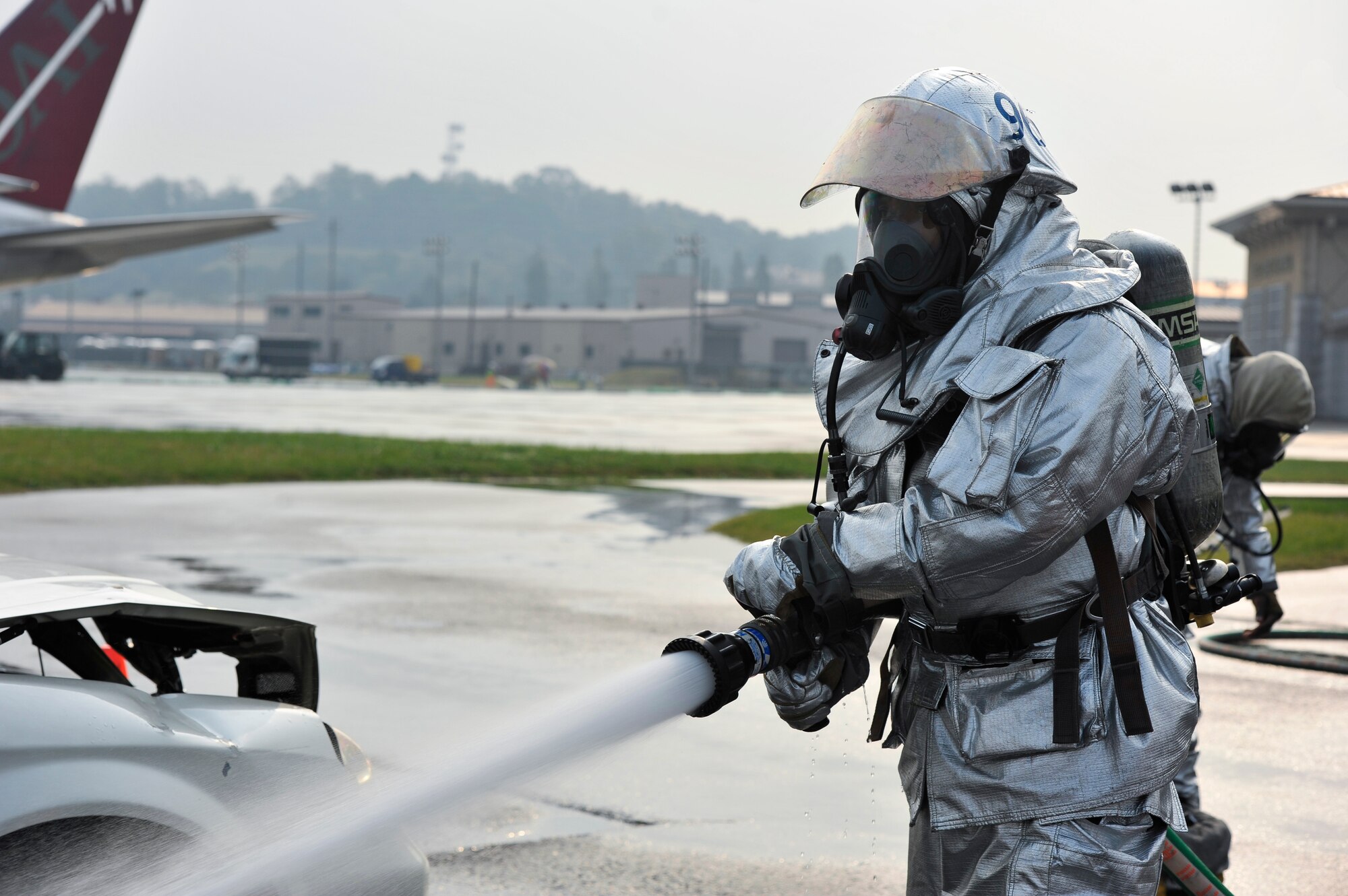 Staff Sgt. Lee Mathews, 51st Civil Engineer Squadron fire emergency services crew chief, puts out a fire during a training scenario Oct. 16 on Osan Air Base, Republic of Korea. Mathews is this week’s Airman Spotlight winner. (U.S. Air Force photo by Senior Airman David Owsianka)
