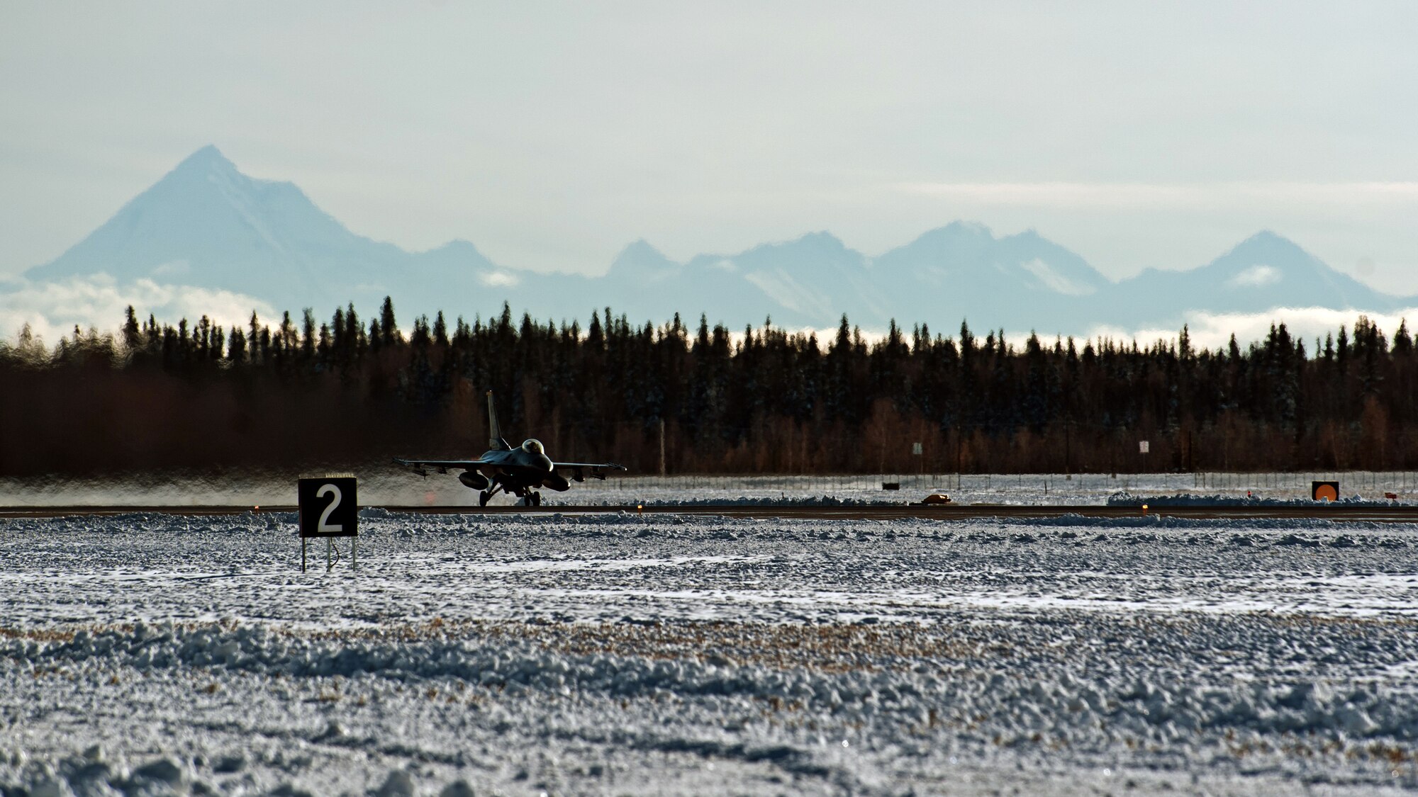 An F-16 Fighting Falcon from Kunsan Air Base, Republic of Korea, takes off during RED FLAG-Alaska 15-1 at Eielson Air Force Base, Oct. 10, 2014. This field training exercise is focused on improving the combat readiness of U.S. and international forces and providing training for units preparing for air expeditionary force tasking. (U.S. Air Force Photo by Senior Airman Taylor Curry/Released)