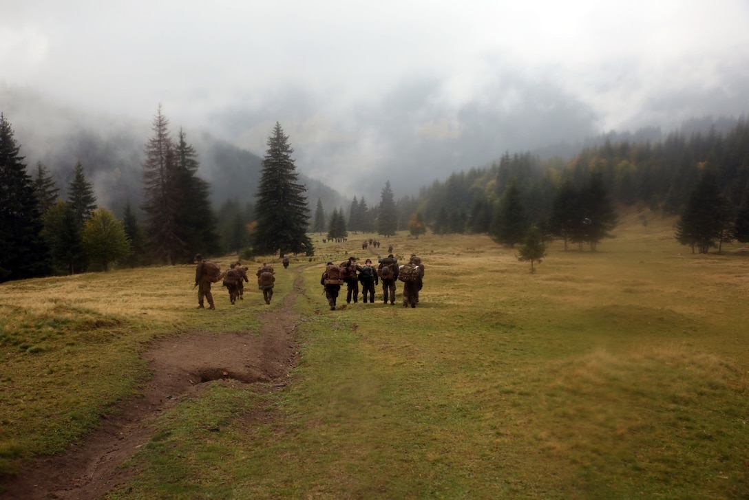 U.S. Marines and sailors from Black sea Rotational Force 14 participated in Platinum Lynx 14.6 in the Carpathian Mountains from Sept. 29 to Oct. 3 in Miercurea Ciuc, Romania. Knowledge and understanding of skills and tactics in mountain regions was shared between the Marines and Romanian Land Forces to help sustain readiness in any location. Service members trained with the 61st Mountain Troops Brigade from the Romanian Land Forces in rappelling, rock climbing, a live-fire range and survival skills. The exercise concluded with a 15-kilometer troop movement in high-elevation terrain. (U.S. Marine Corps photo by Lance Cpl. Ryan Young/released)
