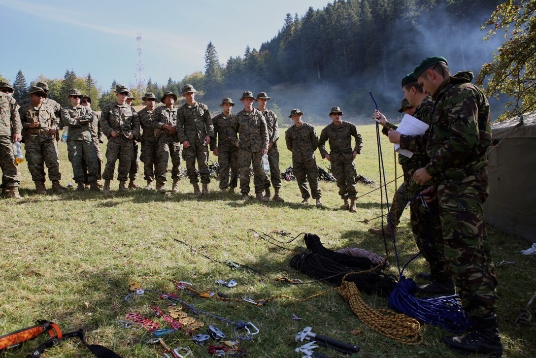 U.S. Marines and sailors from Black Sea Rotational Force 14 participated in Platinum Lynx 14.6 in the Carpathian Mountains from Sept. 29 to Oct. 3 in Miercurea Ciuc, Romania. Knowledge and understanding of skills and tactics in mountain regions was shared between the Marines and Romanian Land Forces to help sustain readiness in any location. Service members trained with the 61st Mountain Troops Brigade from the Romanian Land Forces in rappelling, rock climbing, a live-fire range and survival skills. The exercise concluded with a 15-kilometer troop movement in high-elevation terrain. (U.S. Marine Corps photo by Lance Cpl. Ryan Young/released)