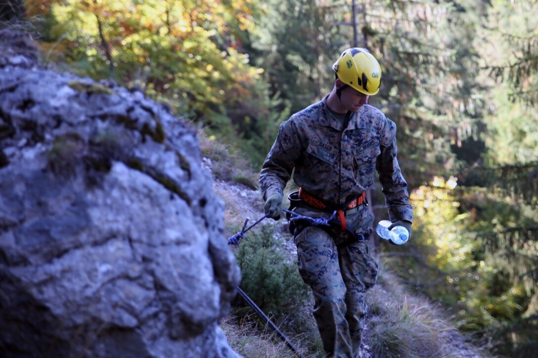 U.S. Marines and sailors from Black Sea Rotational Force 14 participated in Platinum Lynx 14.6 in the Carpathian Mountains from Sept. 29 to Oct. 3 in Miercurea Ciuc, Romania. Knowledge and understanding of skills and tactics in mountain regions was shared between the Marines and Romanian Land Forces to help sustain readiness in any location. Service members trained with the 61st Mountain Troops Brigade from the Romanian Land Forces in rappelling, rock climbing, a live-fire range and survival skills. The exercise concluded with a 15-kilometer troop movement in high-elevation terrain. (U.S. Marine Corps photo by Lance Cpl. Ryan Young/released)