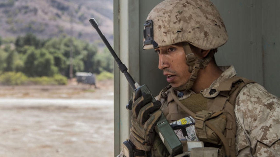 U.S. Marine Sgt. Paul Luna radios for an extraction during a helicopter-raid exercise aboard Camp Pendleton, Calif., Oct. 16, 2014. Luna is a squad leader with Kilo Company, Battalion Landing Team, 3rd Battalion, 1st Marine Regiment, 15th Marine Expeditionary Unit. BLT 3/1 is scheduled to deploy as the 15th MEU’s ground combat element next spring. (U.S. Marine Corps photo by Sgt. Emmanuel Ramos/Released)
