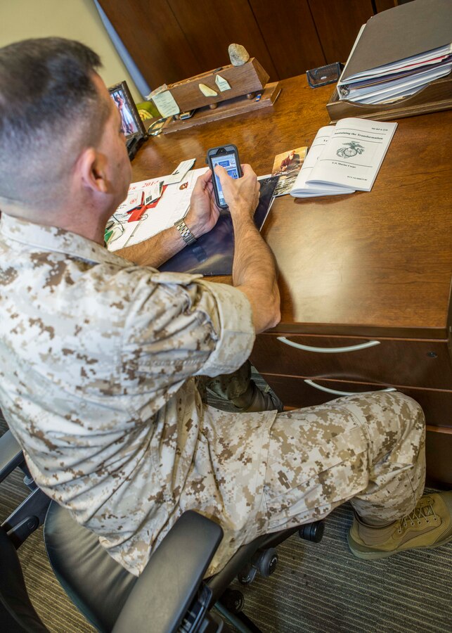 Sgt. Maj. Anthony A. Spadaro, sergeant major of Marine Forces Reserve, learns how to donate money to the Combined Federal Campaign by using the new website on his phone, aboard Marine Corps Support Facility, New Orleans, Oct. 16, 2014. The CFC is the world’s largest and most successful annual workplace charity campaign, with almost 200 CFC campaigns throughout the country and overseas, raising millions of dollars each year. The new CFC website (www.cfctoday.org) will make donating easier and more efficient for those who choose to donate. 