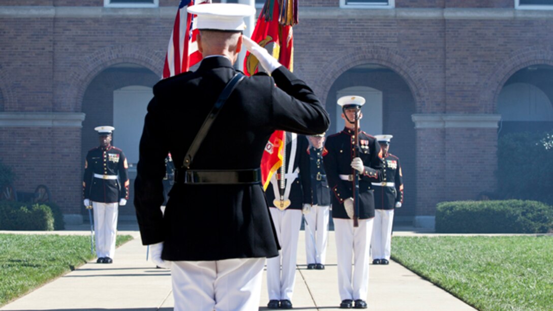 Commandant of the U.S. Marine Corps Gen. Joesph F. Dunford, Jr. salutes the colors during the change of command ceremony at Marine Barracks Washington, D.C., Oct. 17, 2014. Dunford took command from Gen. James F. Amos as the 36th Commandant of the U.S. Marine Corps. (U.S. Marine Corps photo by Cpl. Lauren L. Whitney/Released)
