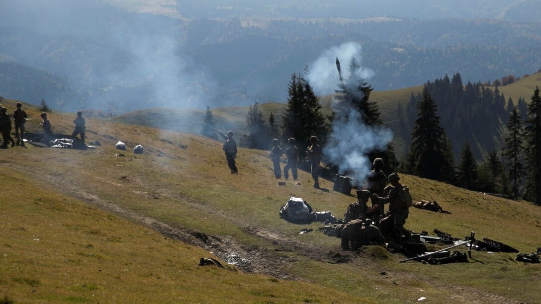 Marines and Sailors on Black Sea Rotational Force 14, with members of the Romanian Land Forces, worked together during Platinum Lynx at the Carpathian Mountains, Romania. Marines and Romanians fostered knowledge through weapons familiarization classes and mountain warfare training. 