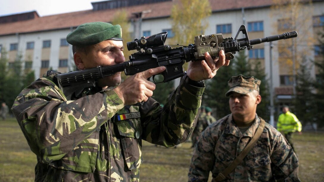 Marines and Sailors on Black Sea Rotational Force 14, with members of the Romanian Land Forces, worked together during Platinum Lynx at the Carpathian Mountains, Romania. Marines and Romanians fostered knowledge through weapons familiarization classes and mountain warfare training. 