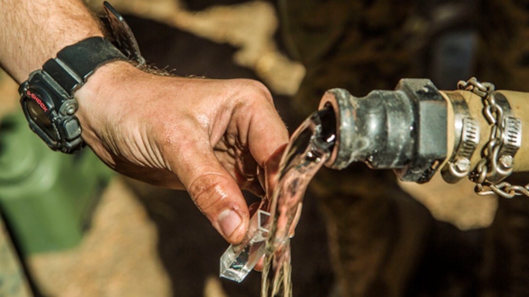U.S. Marine Corps water support technicians with Headquarters and Service Company, Combat Logistics Battalion 6, 2nd Marine Logistics Group, purify river water using the Lightweight Water Purification System at Mountain Warfare Training Center, Bridgeport, California, October 20, 2014. CLB-6 stayed at MWTC to attend the basic mobility course and to provide logistical support to 2nd Battalion 5th Marine Regiment, 1st Marine Division. (U.S. Marine Corps photo by Cpl. Desire M. Mora/Released)