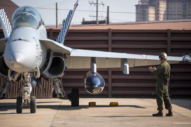 Cpl. Nicholas Cochran, a powerline mechanic with Marine All-Weather Fighter Attack Squadron 533, conducts pre-flight checks on an F/A-18 Hornet during the Korean Marine Exchange Program 14-13, Oct. 13, 2014, on Osan Air Base, Republic of Korea. KMEP 14-13 is a multinational exercise that will focus on the integration of aviation and ground assets within the construct of a traditional Combined Arms Live Fire Exercise. Supporting units include, but are not limited to, Marine Aviation Logistics Squadron 12 and Marine Wing Support Squadron 171.