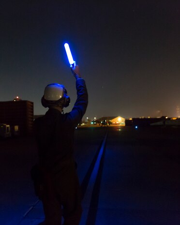 Lance Cpl. Bobby Tyler, a plane captain with Marine All-Weather Fighter Attack Squadron 533, signals to an F/A-18 Hornet during the Korean Marine Exchange Program 14-13, Oct. 13, 2014, on Osan Air Base, Republic of Korea. KMEP 14-13 is a multinational exercise that will focus on the integration of aviation and ground assets within the construct of a traditional Combined Arms Live Fire Exercise. Supporting units include, but are not limited to, Marine Aviation Logistics Squadron 12 and Marine Wing Support Squadron 171.