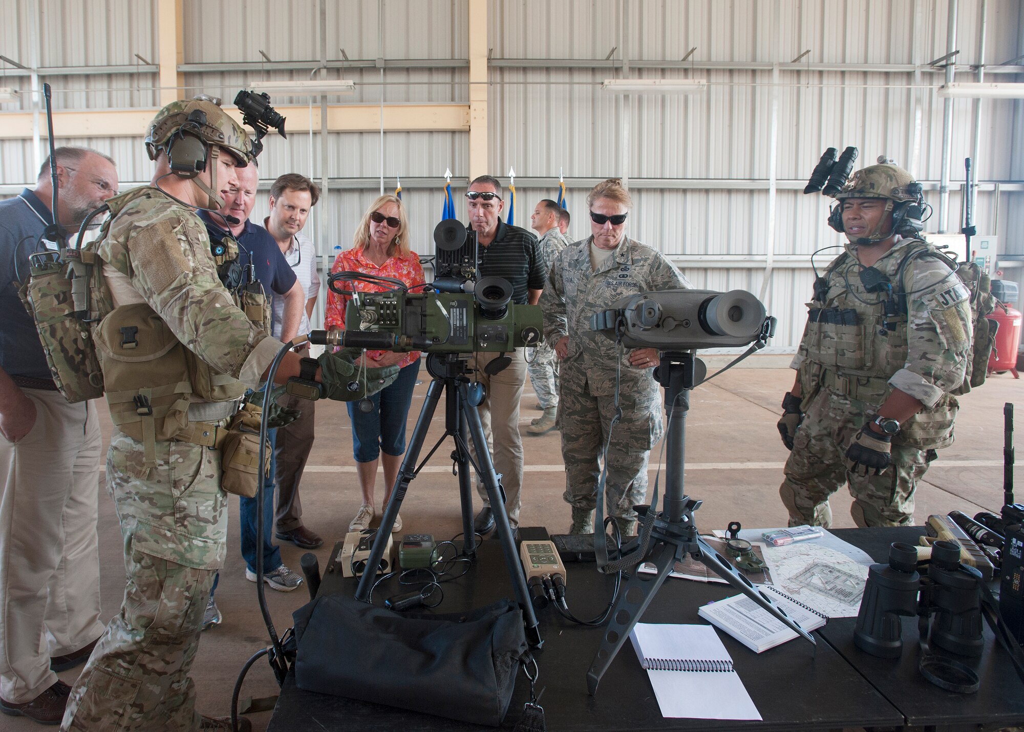 Members of the Air Force Civic Leader Program learn about the tactical air control mission during a tour of the 25th Air Support Operations Squadron at Wheeler Army Air Field, Hawaii, Oct. 15, 2014. The civic leaders interacted with Joint Tactical Air Controllers and Tactical Air Control Party Airmen and received a weather, vehicle and radar equipment familiarization demonstration during their tour. At the invitation of Gen. Mark Welsh III, Air Force Chief of Staff, and hosted by Pacific Air Forces, the civic leaders spent three days visiting military installations and units to gain a hands-on understanding of the missions and capabilities of the Air Force, Army, Marine Corps, Navy and Coast Guard, and their respective contributions to the Pacific Rebalance. (U.S. Air Force photo by Tech. Sgt. Lucelia Ball/Released)