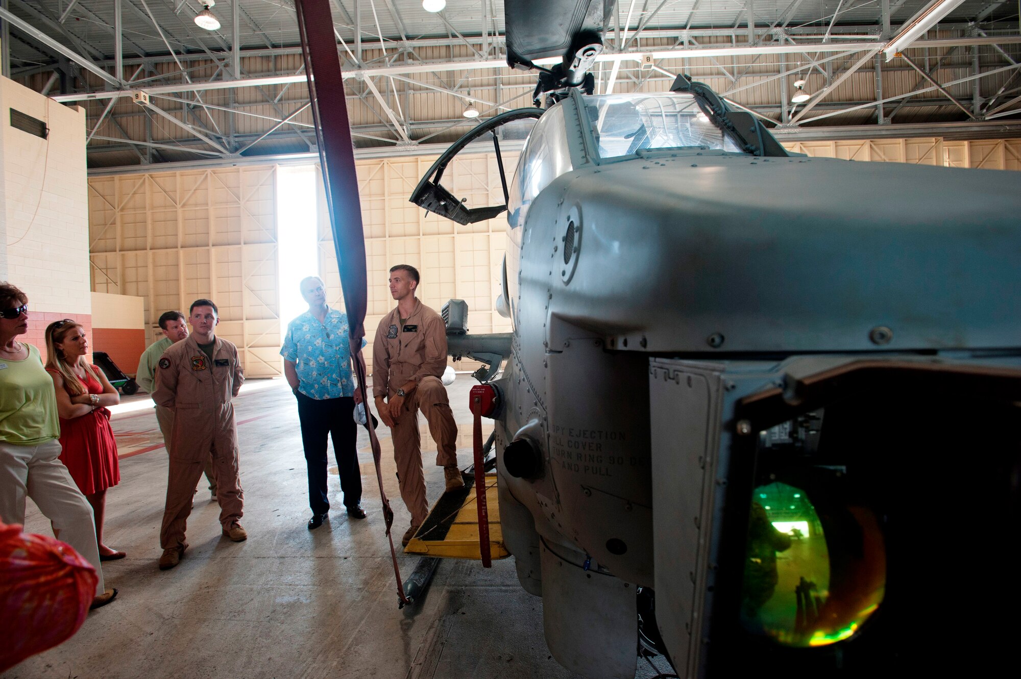 Marine aviators assigned to Marine Corps Base-Hawaii brief members of the Air Force Civic Leader Program about the capabilities of the AH-1 Cobra attack helicopter, Oct. 15, 2014. At the invitation of Gen. Mark Welsh III, Air Force Chief of Staff, and hosted by Pacific Air Forces, the civic leaders spent three days visiting military installations and units to gain a hands-on understanding of the missions and capabilities of the Air Force, Army, Marine Corps, Navy and Coast Guard, and their respective contributions to the Pacific Rebalance. (U.S. Air Force photo by Tech. Sgt. Lucelia Ball/Released) 