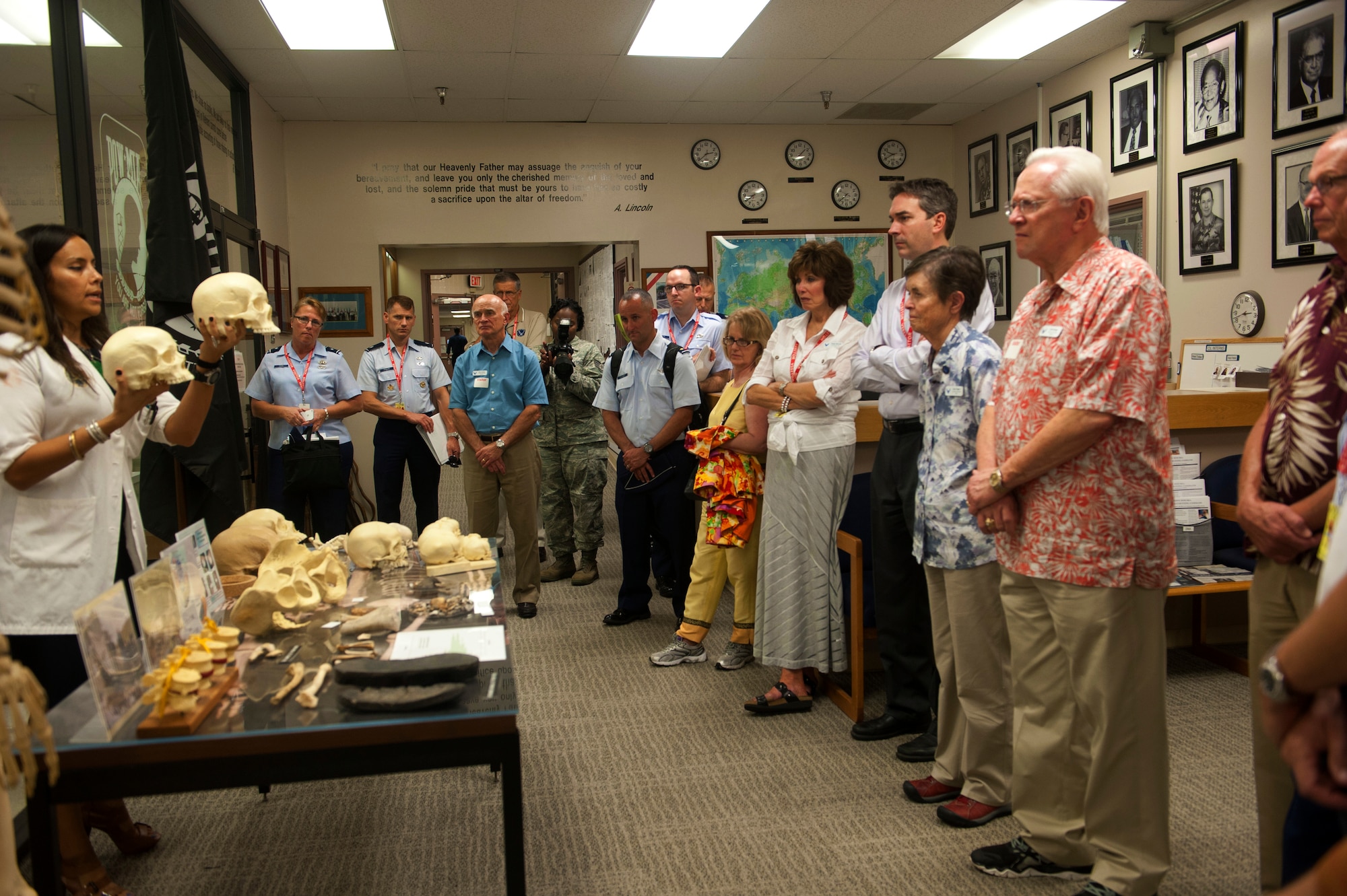 Members of the Air Force Civic Leader Program receive a briefing from forensic anthropologist Dr. Meghan-Tomasita Cosgriff-Hernandezon processes used to identify human remains during the group’s visit to the Joint POW/MIA Accounting Command at Joint Base Pearl Harbor-Hickam, Oct. 14, 2014. While there, the group received an in-depth look at how JPAC locates, recovers and identifies America’s missing in action from all past wars and conflicts. At the invitation of Air Force Chief of Staff Gen. Mark Welsh III, and hosted by Pacific Air Forces, the civic leaders spent three days visiting military installations and units like JPAC to gain a hands-on understanding of the missions and capabilities of the Air Force, Army, Marine Corps, Navy and Coast Guard, and their respective contributions to the Pacific Rebalance. (U.S. Air Force photo by Tech. Sgt. Lucelia Ball/Released)