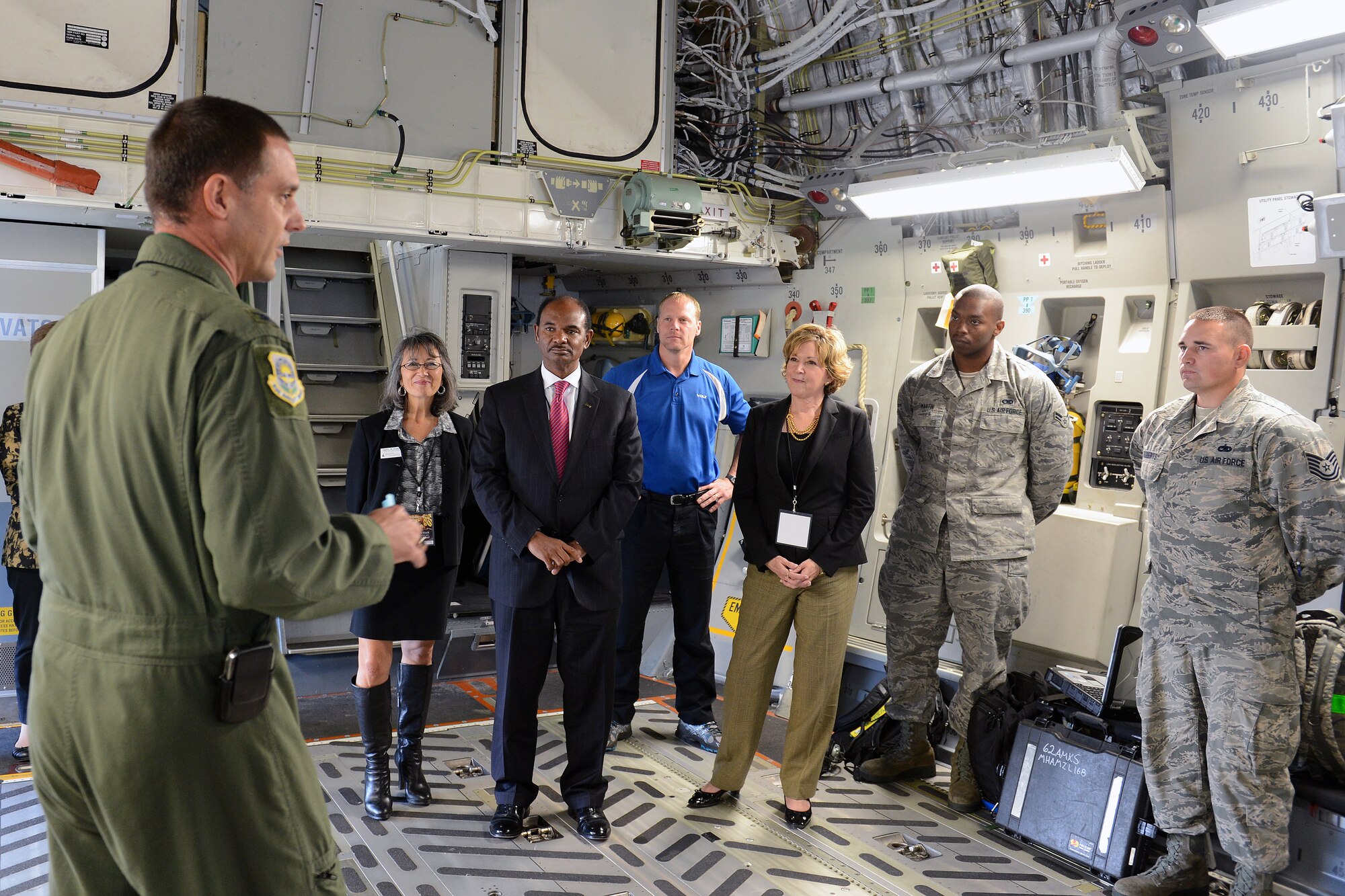 Col. Ethan Griffin (left), 62nd Airlift Wing vice commander, briefs visitors about a C-17 Globemaster III Oct. 21, 2014, during the Joint Base Lewis-McChord Service Member for Life Transition Summit at JBLM, Wash. The group consisted of CEO’s and directors from various companies and associations in Washington visiting for an opportunity to learn JBLM’s mission. (U.S. Air Force photo/Airman 1st Class Keoni Chavarria)
