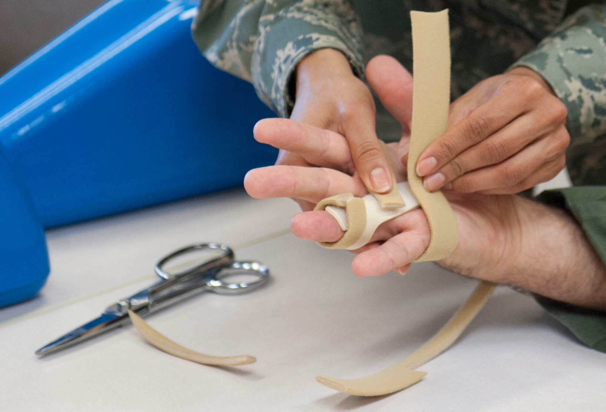 Capt. Matilda Brunner, 99th Medical Operations Squadron occupational therapist, fits a patient’s finger for a splint for maximum recovery and comfort at the Mike O’ Callaghan Federal Medical Center on Nellis Air Force Base, Nev. Oct. 20, 2014. Nellis houses one of the eight stateside occupational therapy clinics. The clinic at Nellis specializes in cognitive rehab, mental health and upper extremity rehab. (U.S. Air Force photo by Airman 1st Class Rachel Loftis)  