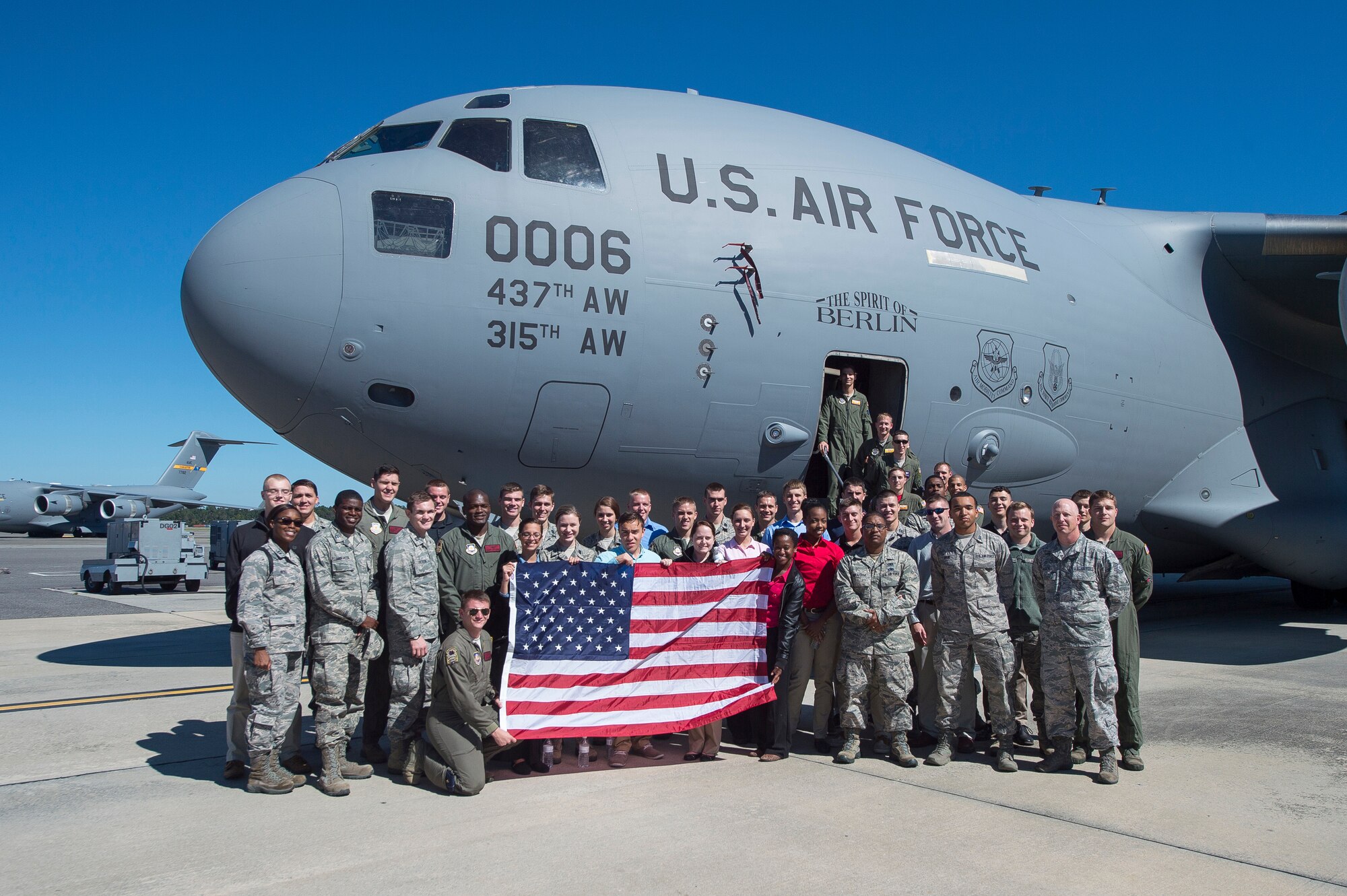 Cadets from the University of South Carolina Reserve Officer Training Corps pose for a group photo Oct. 17, 2014, after an orientation flight at Joint Base Charleston, S.C. In addition to the orientation flight, cadets visited the 628th Logistic Readiness Squadron mobility warehouse and observed a military working dog demonstration from the 628th Security Forces Squadron. Air Force ROTC is a program that develops commissioned officers for the Air Force while working toward a college degree.  (U.S. Air Force photo / Senior Airman George Goslin)