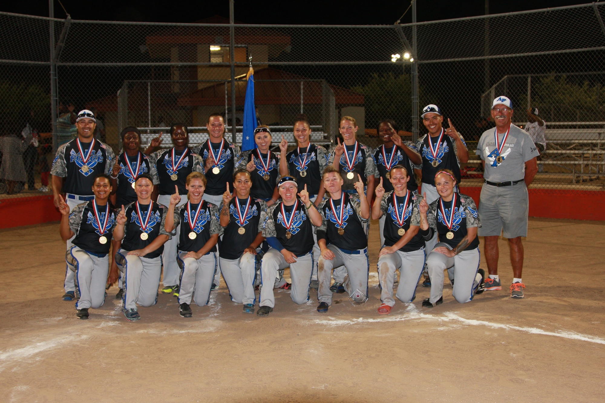 The 2014 All-Air Force Women's Softball team poses for a group photo after winning the gold medal during the 2014 Armed Forces Softball Championship at Fort Sill, Okla., Sept 19, 2014. (photo by Steve Brown)