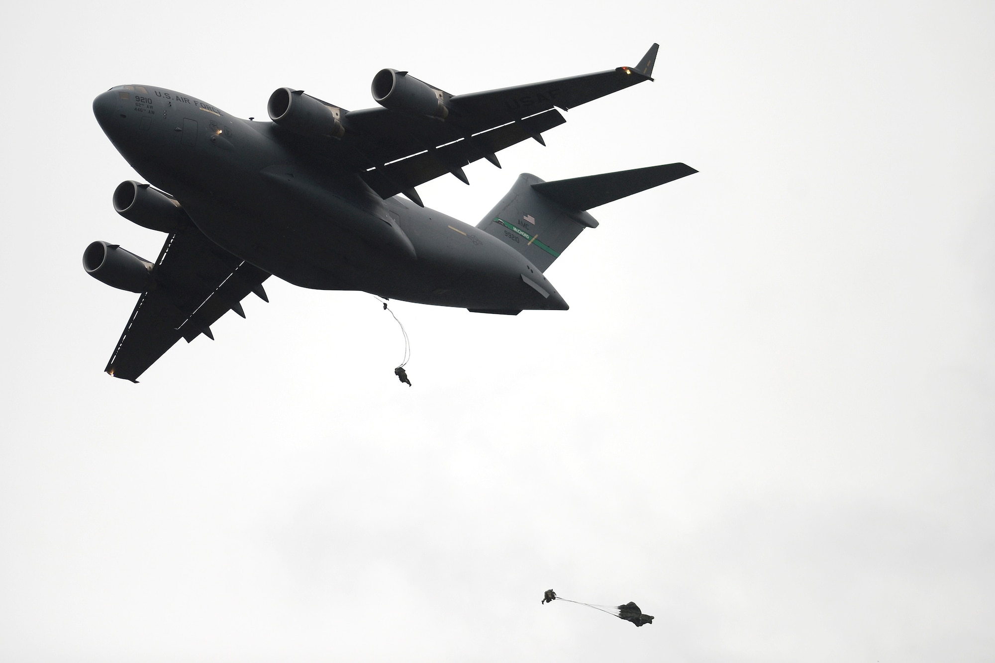 Airmen from the 22nd Special Tactics Squadron jump out of a C-17 Globemaster III October 21, 2014, during a training exercise at Joint Base Lewis-McChord, Wash. An aircrew from the 7th Airlift Squadron flew the C-17 providing Airmen from the 22nd STS the opportunity for static line and high altitude low opening jump training. (U.S. Air Force photo/A1C Keoni Chavarria)