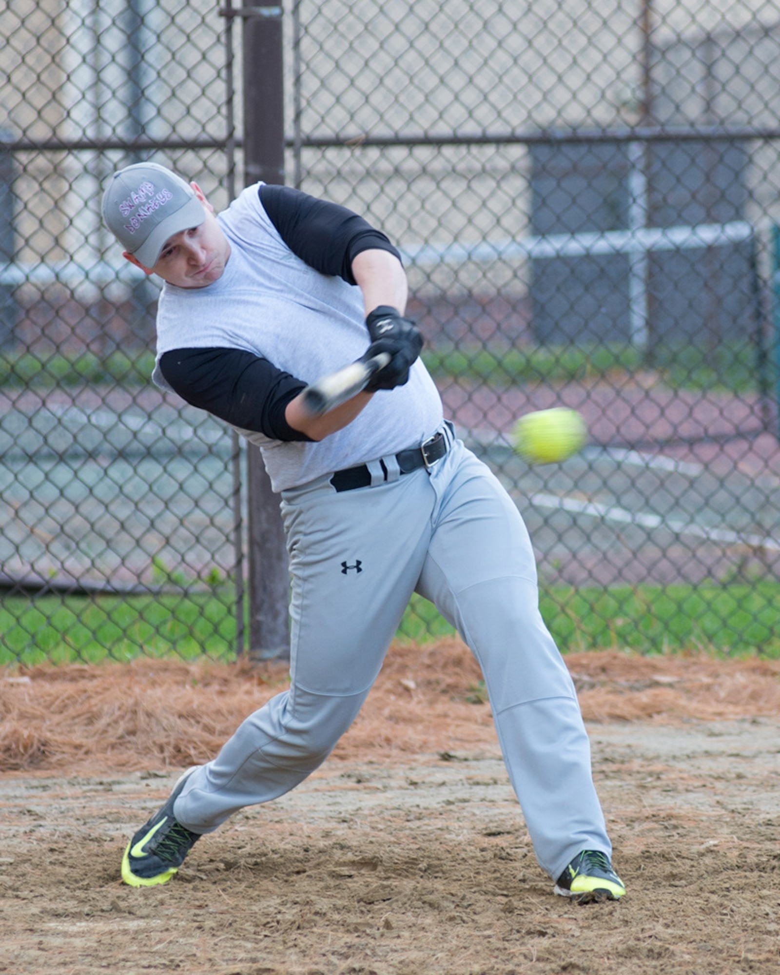 Staff Sgt. Sean Germain, 66th Medical Squadron Immunization technician, takes a swing during one of two intramural softball games on base Oct. 21 between the 66th Air Base Group and the 25th Marine Regiment, 4th Marine Division assigned to Fort Devens. The ABG team went on to win the two games by a score of 10 to 1 and 11 to 7. (U.S. Air Force photo by Mark Herlihy)