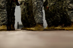U.S. Army Soldiers assigned to the 53rd Transportation Battalion (Movement Control), 7th Transportation Brigade (Expeditionary), participate in a deployment ceremony at Fort Eustis Va., Oct. 22, 2014. The battalion specializes in the movement of Soldiers, equipment and other critical assets to deployed locations. (U.S. Air Force photo by Airman 1st Class Kimberly Nagle/Released) 