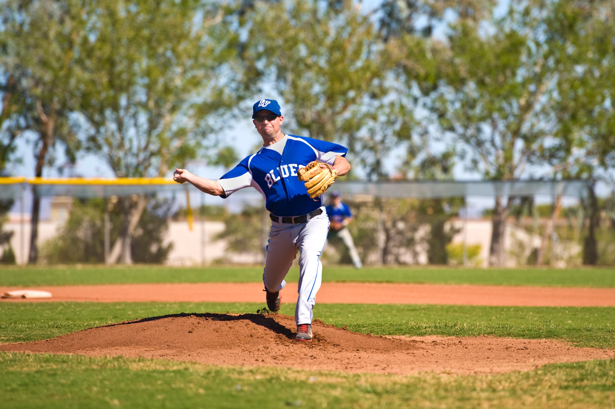Blake Bennett, Las Vegas Blues baseball team pitcher, pitches during their 10-0 loss to the Las Vegas Angels in the Southern Nevada Adult League championship game at Rainbow Family Park in Las Vegas, Nev., Oct. 19, 2014. The Las Vegas Blues baseball team played 13 games this season, including three playoff games leading up to their 10-0 loss to the Las Vegas Angels in the championship game. (U.S. Air Force photo by Senior Airman Christopher Tam)