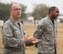 VANCE AIR FORCE BASE, Okla. -- Chaplain (Lt. Col.) Randall Groves, the 71st Flying Training Wing chaplain, and Tech. Sgt. Durrell Edwards, a chaplain’s assistant, speaks to a class of Joint Specialized Undergraduate Pilot Training students during parachute landing fall training at the Aerospace Physiology parachute landing fall training facility Oct. 10. Every three weeks 