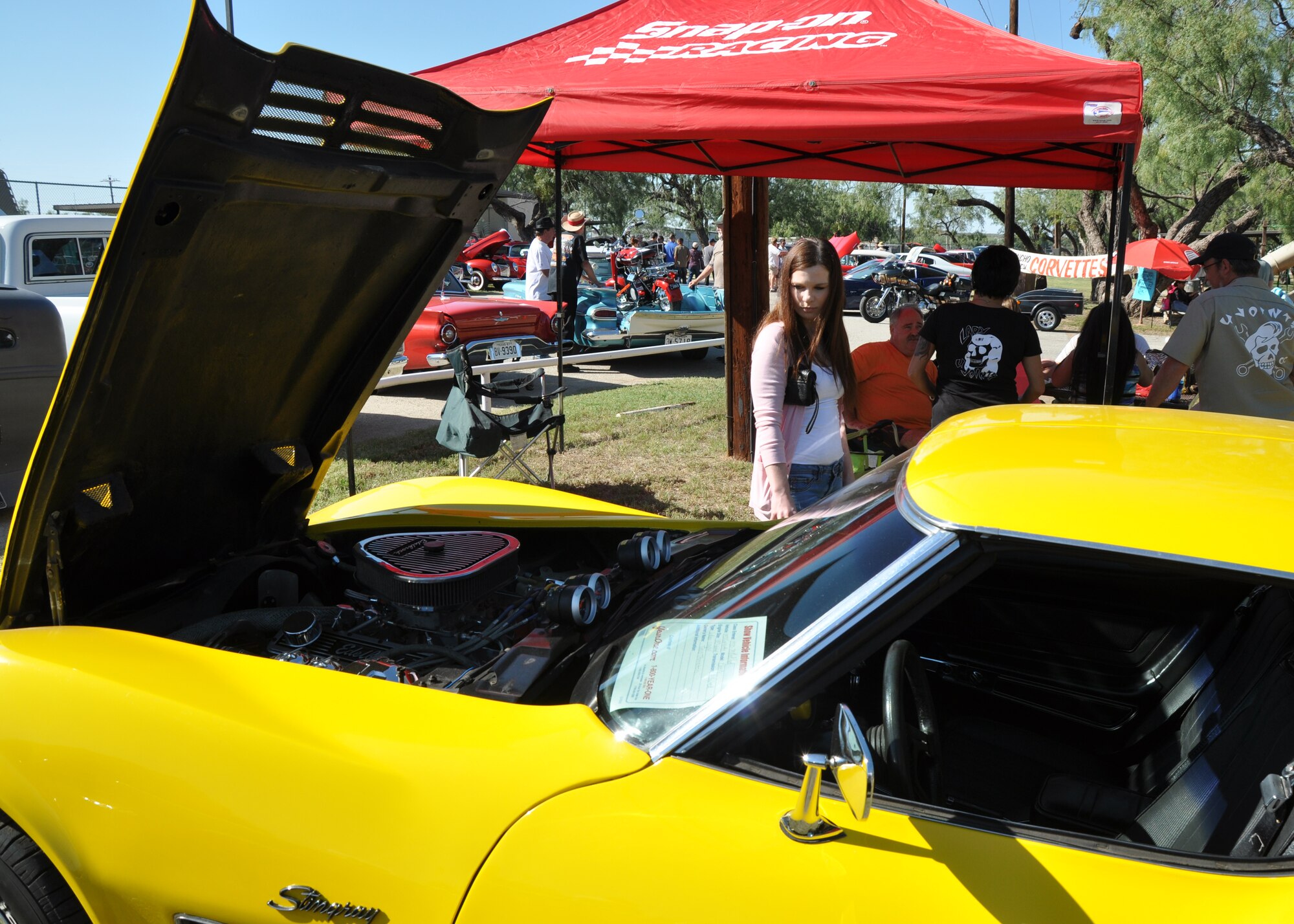 GOODFELLOW AIR FOCE BASE, Texas – Airman 1st Class April M. Schmoe, 17th Medical Group dental assistant, looks at a 1972 Chevrolet Corvette during the 16th Annual Goodfellow Recreation Camp Car, Boat and Motorcycle Show Oct. 18. At this year’s show, Schmoe and other visitors had the chance to look at more than 100 cars, boats and motorcycles. (U.S. Air Force photo/ Senior Airman Joshua Edwards)