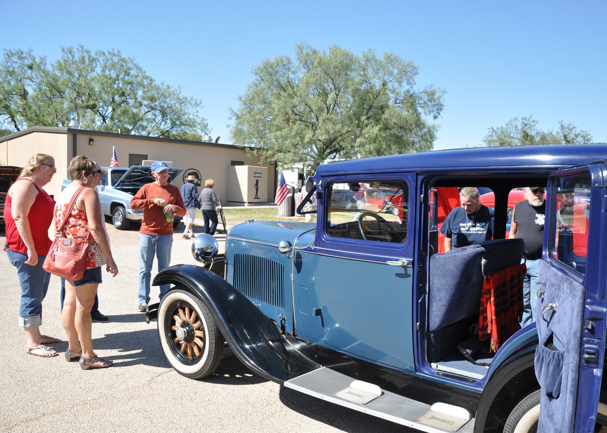GOODFELLOW AIR FOCE BASE, Texas – People look at a 1928 Dodge Brothers Straight 6 during the 16th Annual Goodfellow Recreation Camp Car, Boat and Motorcycle Show Oct. 18. This car competed in the oldest category at the car show, 1900 to 1930.  (U.S. Air Force photo/ Senior Airman Joshua Edwards)