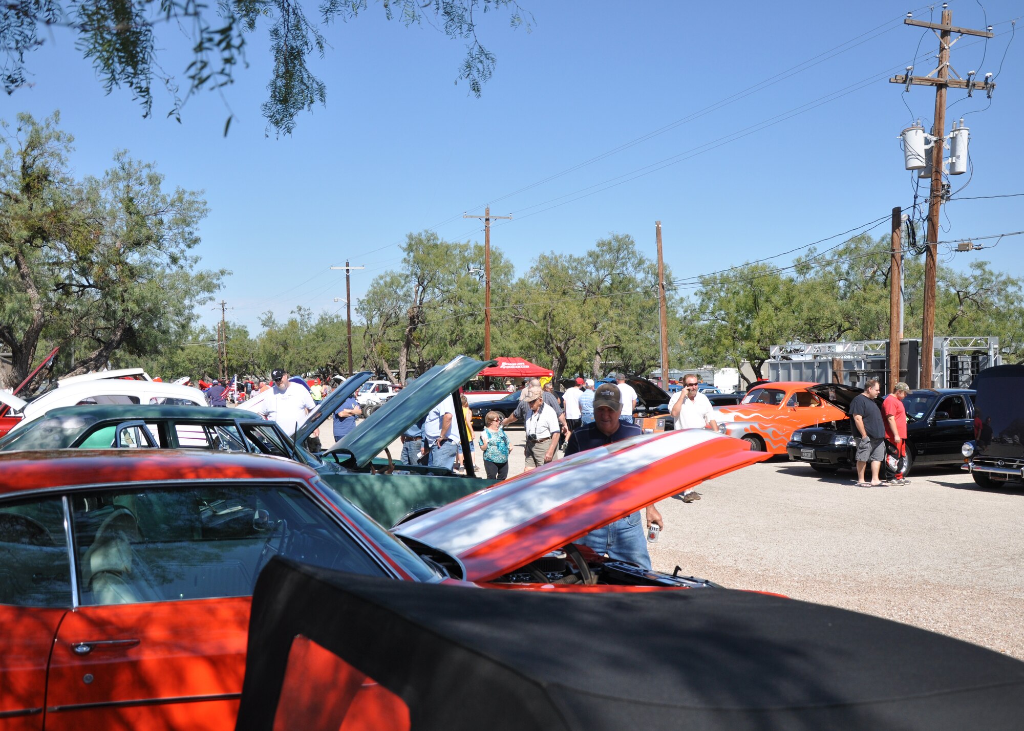 GOODFELLOW AIR FOCE BASE, Texas – Onlookers check out cars during the 16th Annual Goodfellow Recreation Camp Car, Boat and Motorcycle Show Oct. 18. The car show features cars from the early 1900s to 2014. (U.S. Air Force photo/ Senior Airman Joshua Edwards)