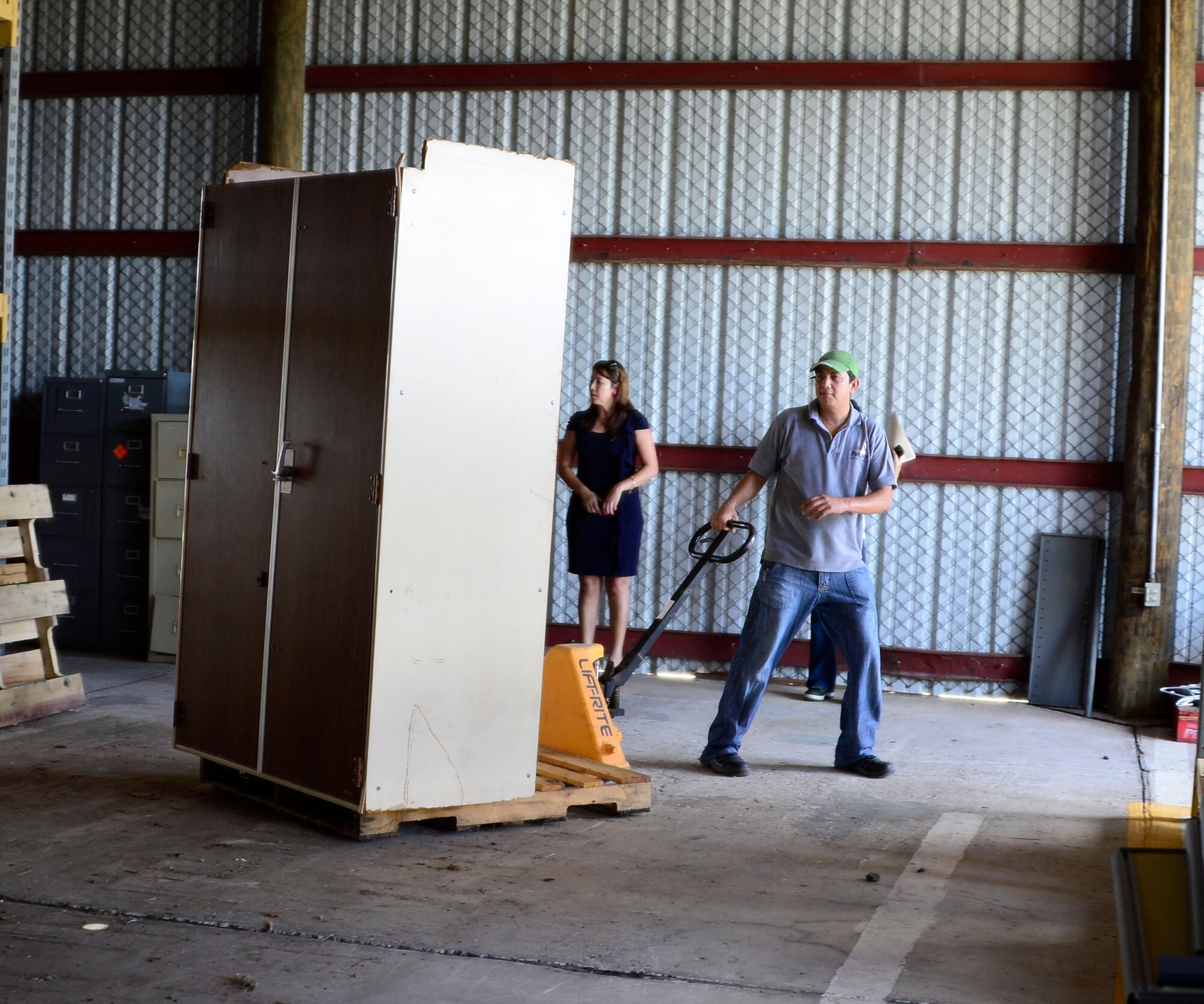 Members of Joint Task Force-Bravo’s Civil and Military Operations Office help load used furniture donated through the Defense Reutilization and Marketing Office onto moving trucks on Soto Cano Air Base, Honduras, Oct. 14, 2014. DRMO, the U.S. State Department the U.S. Agency for International Development worked together to transfer over $100,000 worth of furniture and vehicles to USAID project Youth Alliance Honduras.  DRMO offices receive and screen all property turned in by base agencies for reutilization and reuse. If items cannot be reused within the Department of Defense, it is considered for transfer or donation to other federal or state agencies, or other qualified organizations.  (U.S. Air Force photo /Tech. Sgt. Heather Redman)