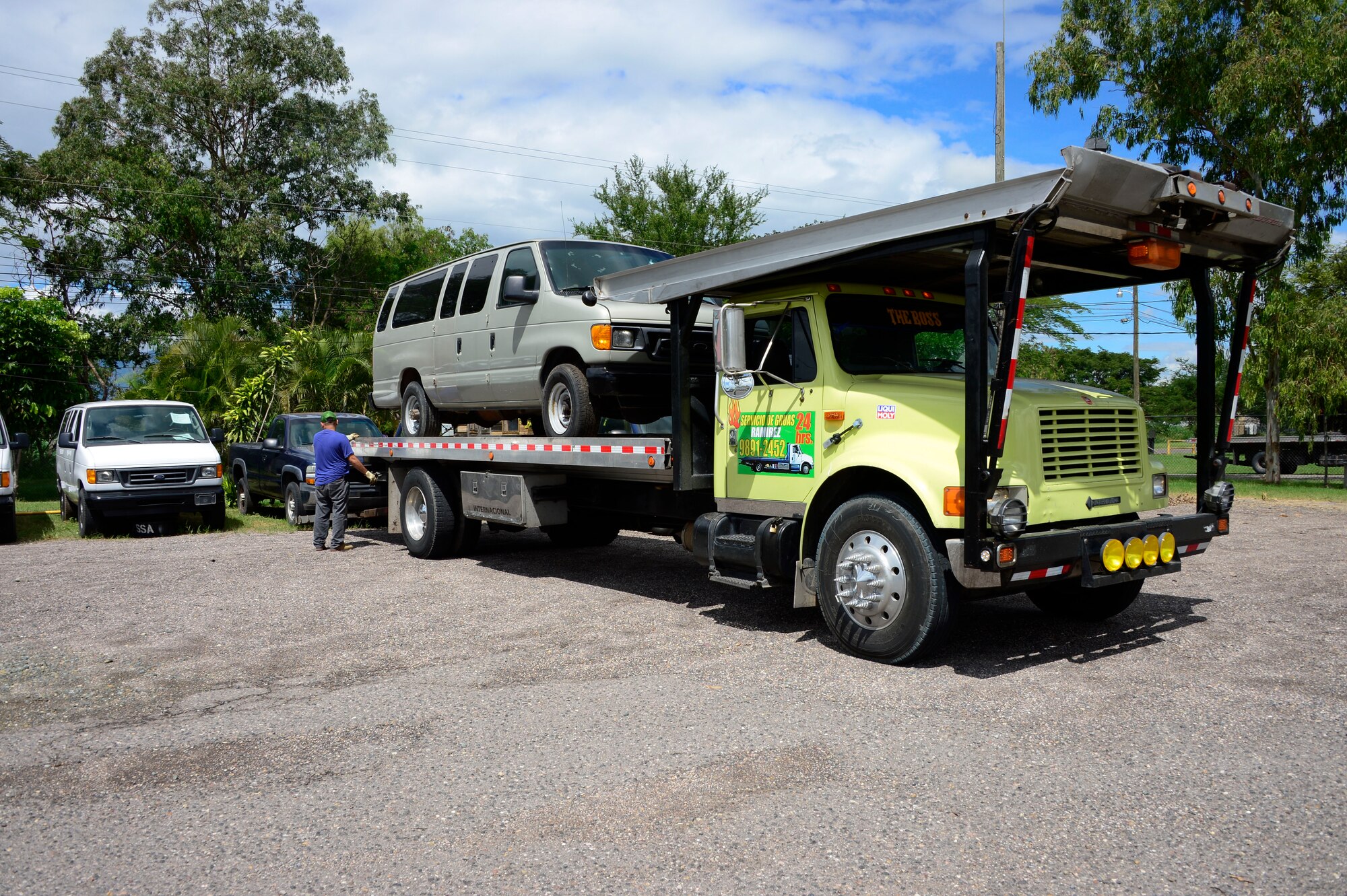Members of Joint Task Force-Bravo’s Civil and Military Operations Office help load vehicles donated through the Defense Reutilization and Marketing Office onto flat bed trucks on Soto Cano Air Base, Honduras, Oct. 14, 2014. DRMO, the U.S. State Department and the U.S. Agency for International Development worked together to transfer over $100,000 worth of furniture and vehicles to USAID project Youth Alliance Honduras.  DRMO offices receive and screen all property turned in by base agencies for reutilization and reuse. If items cannot be reused within the Department of Defense, it is considered for transfer or donation to other federal or state agencies, or other qualified organizations.  (U.S. Air Force photo /Tech. Sgt. Heather Redman)