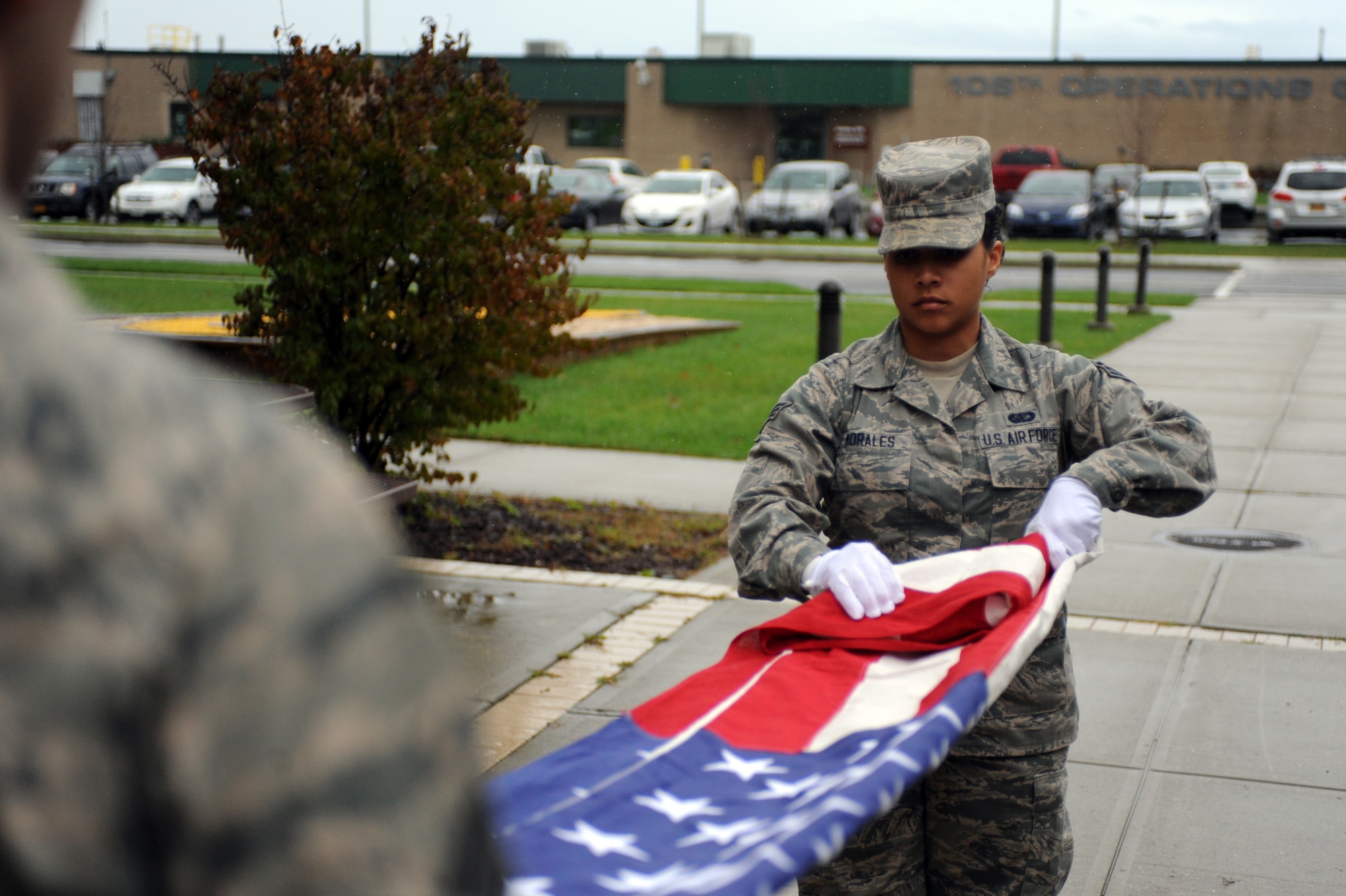 Members of the New York Air National Guard's 106th Rescue Wing Base Honor Guard rehearse a flag folding and presentation ceremony at Gabreski Air National Guard Base on Oct. 16, 2014. The Honor Guard Airmen performed more than 619 ceremonies in 2013. This was more than any other Air National Guard Honor Guard in the country. (U.S. Air National Guard Photo by Senior Airman Christopher S. Muncy/Released)