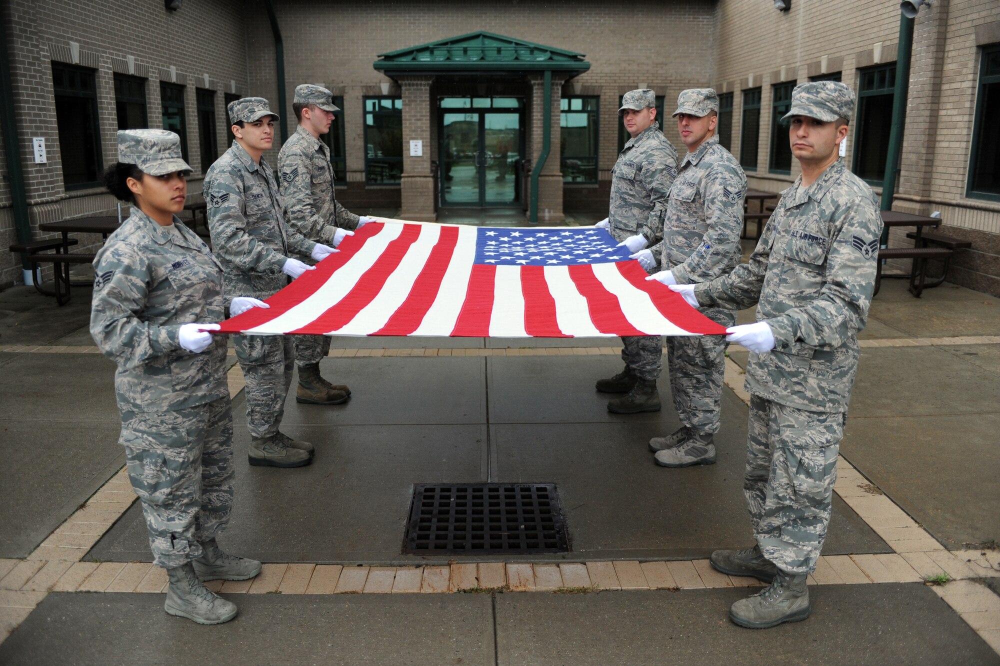 Members of the New York Air National Guard's 106th Rescue Wing Base Honor Guard rehearse a flag folding and presentation ceremony at Gabreski Air National Guard Base on Oct. 16, 2014. The Honor Guard Airmen performed more than 619 ceremonies in 2013. This was more than any other Air National Guard Honor Guard in the Country. (U.S. Air National Guard Photo by Senior Airman Christopher S. Muncy/Released)