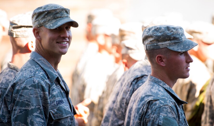 U.S. Air Force 1st Lt. Casey Garner, left, 7th Air Support Operations Squadron air liaison officer, smirks at the camera prior to his graduation from Ranger School Oct. 17, 2014, at Fort Benning, Ga. As an ALO, Garner works in austere environments and helps provide air support while attached to Army units. (U.S. Air Force photo by Airman 1st Class Ryan Callaghan/Released)