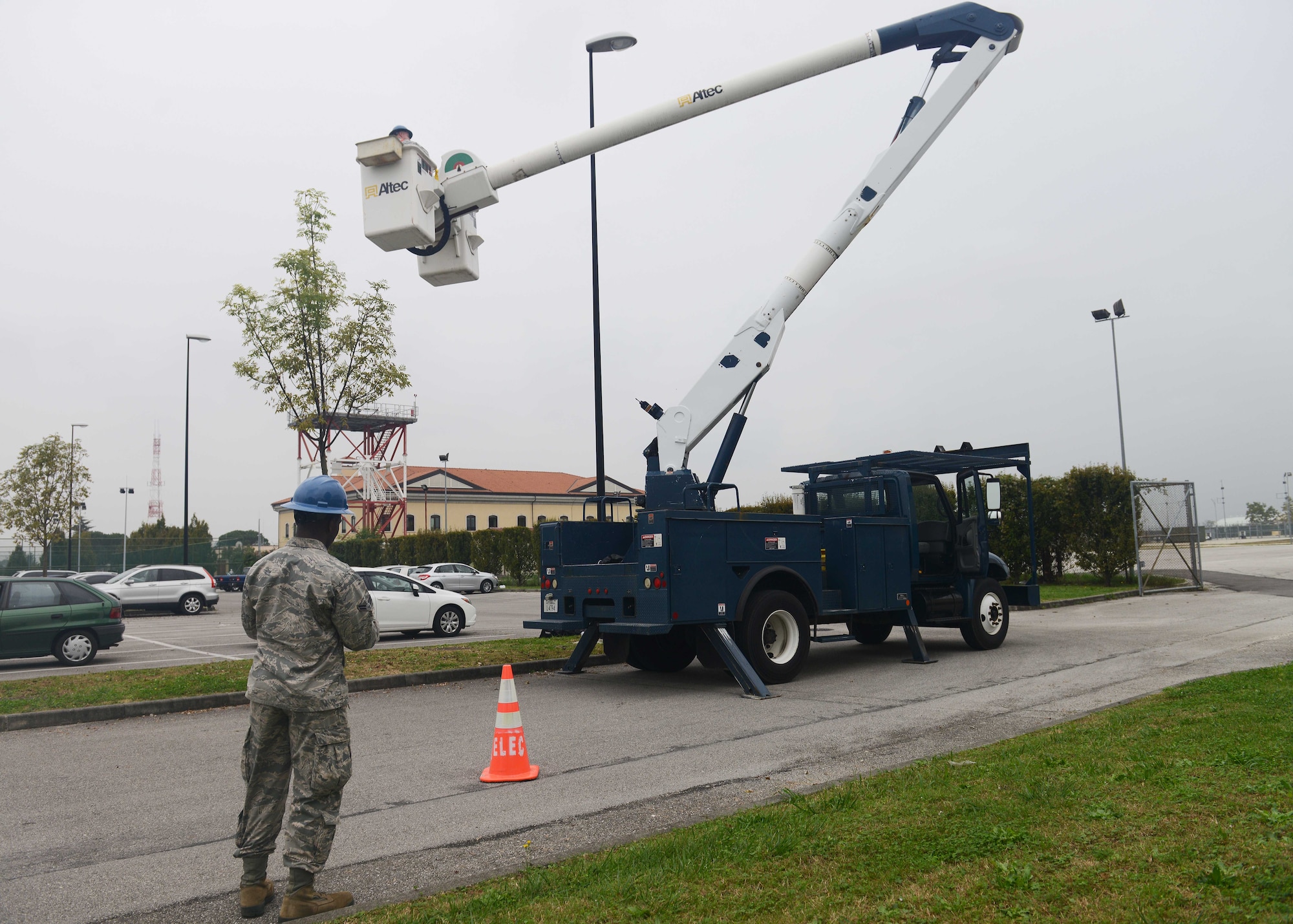 Electrical systems Airmen from the 31st Civil Engineer Squadron change a light bulb, Oct. 20, 2014, at Aviano Air Base, Italy. The recent project that was completed in April, Operation Right Lights, was an energy saving initiative that saved the Air Force over $30,000 annually. (U.S. Air Force photo/Airman 1st Class Deana Heitzman)