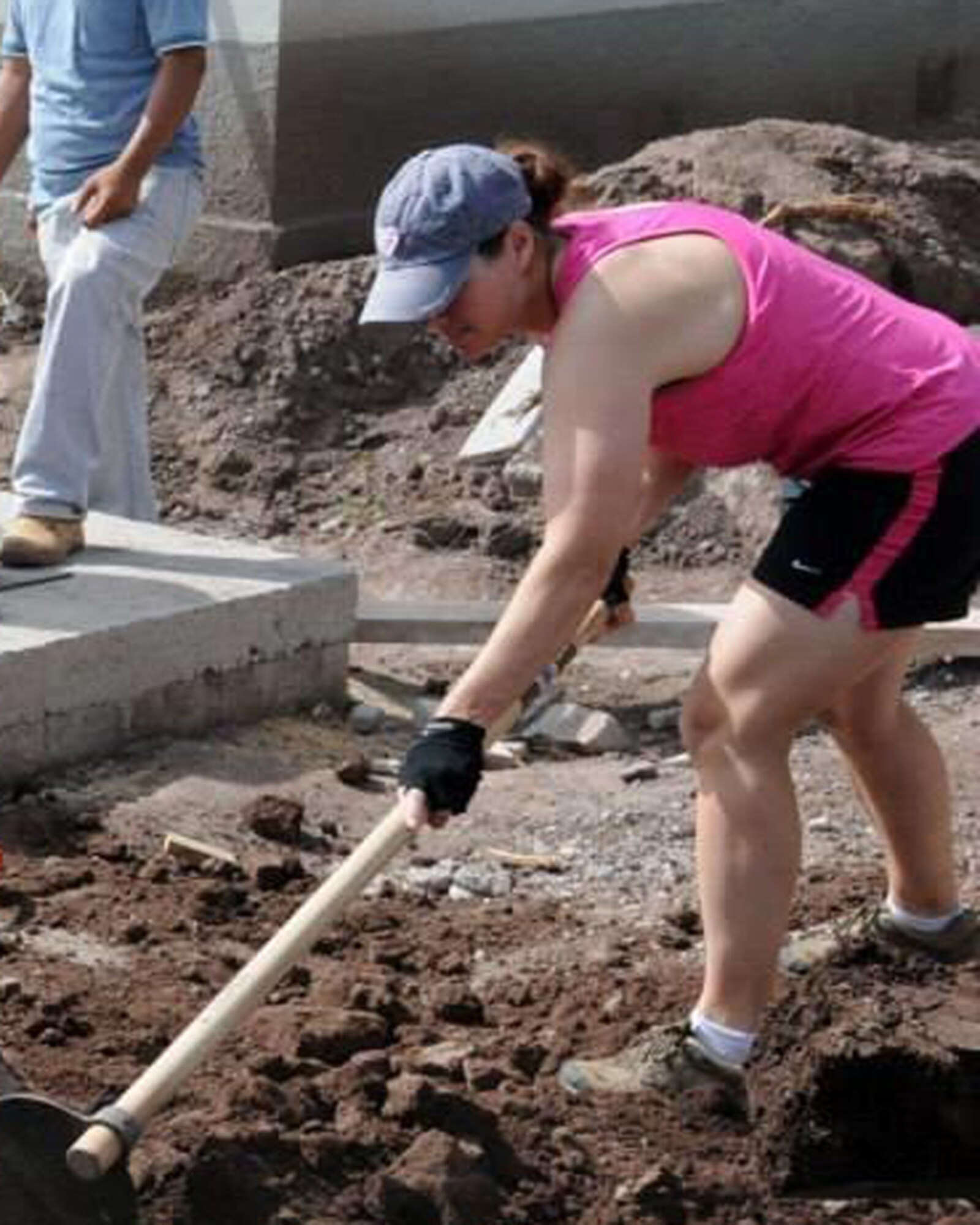 U.S. Air Force Capt. Sherri Pierce, JTF-Bravo Logistics director, and others volunteer at a Habitat for Humanity project at the Ajuterique Housing Project June 28 in Comayagua, Honduras. Members of JTF-Bravo filled trenches and leveled ground outside of homes at the housing project to assist Honduran families waiting to move into their new homes. The Ajuterique Housing Project is a long-term project that’s already helped construct more than 50 homes for Honduran families. (Courtesy photo)