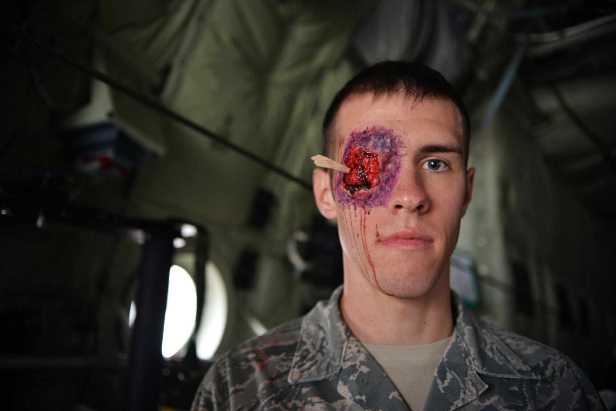 Senior Airman Jonathan Burns, 786th Civil Engineer Squadron electrical systems journeyman, waits inside a C-130J Super Hercules for the Major Accident Response Exercise to begin on Ramstein Air Base, Germany, Oct. 18, 2014. Members of the U.S. Air Force and Host Nation agencies partnered in conducting a response and recovery exercise in preparation for possible real-world incidents. (U.S. Air Force photo/Senior Airman Hailey Haux)