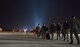 Nearly 30 Airmen walk down the flightline after arriving at Ramstein Air Base, Germany from West Africa, Oct. 19, 2014. Any personnel traveling into Ramstein from Ebola infected areas will be medically screened upon their arrival and cleared by public health for onward travel to ensure the health and safety of all passengers, aircrew and members of the Kaiserslautern community. (U.S. Air Force photo/Staff Sgt. Sara Keller)